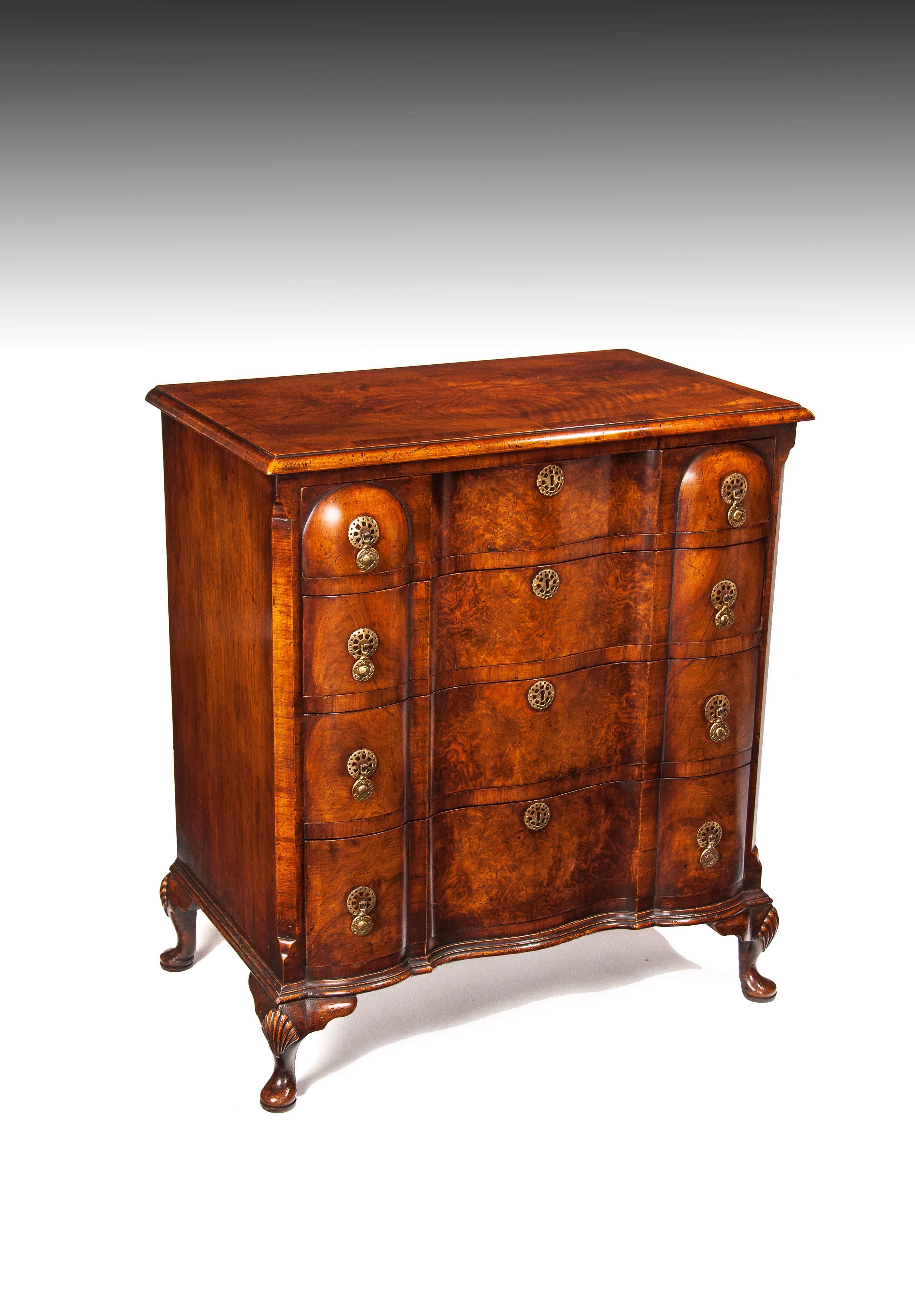 A superb quality antique shaped front walnut chest of drawers standing on cabriole feet, Queen Anne Style.

English, circa 1900.


The construction of this chest of drawers has been closely matched to an 18th Century example with fine attention
