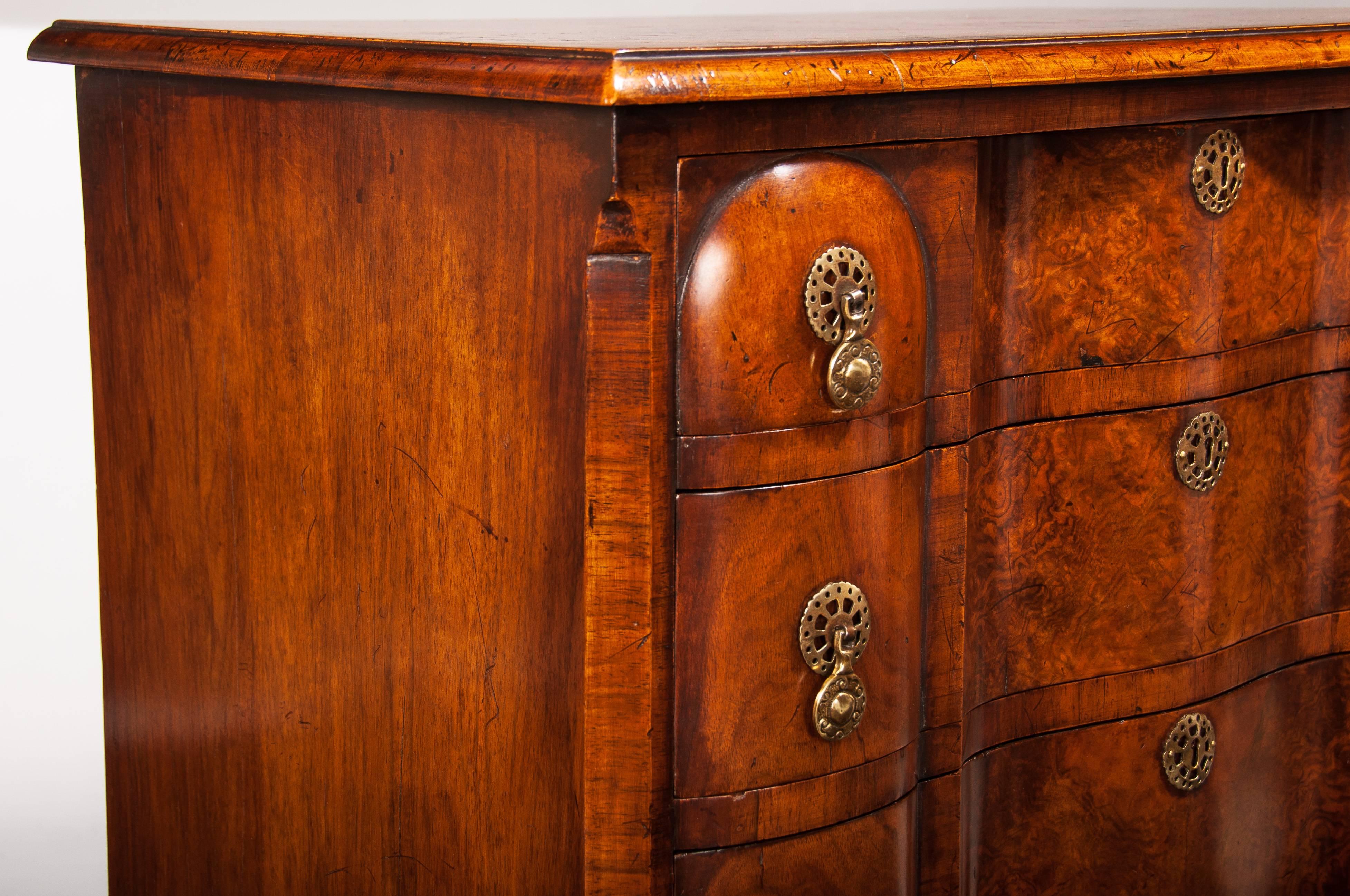 English Antique Walnut Chest of Drawers of an Elegant Shaped Front Design