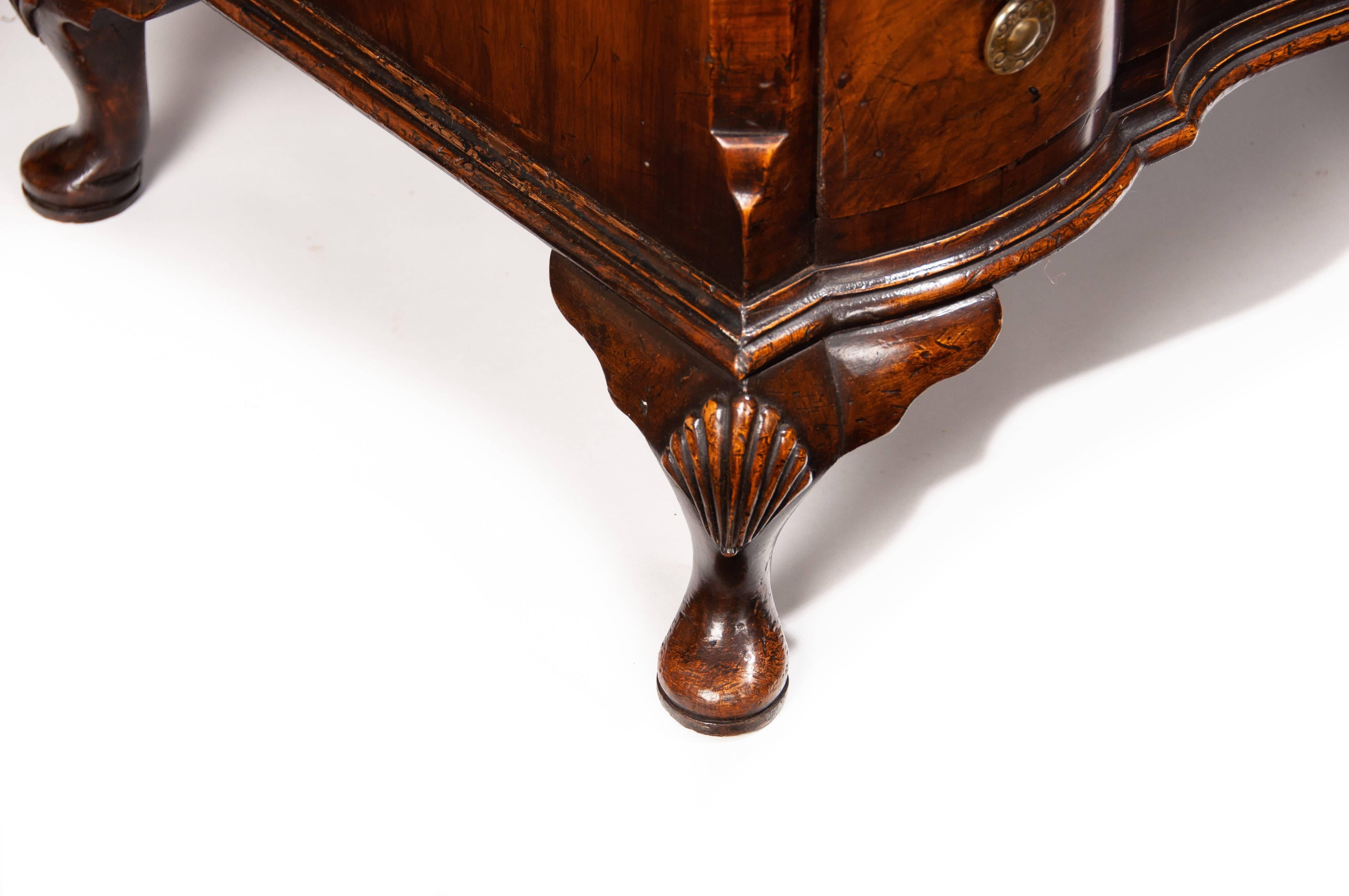 Polished Antique Walnut Chest of Drawers of an Elegant Shaped Front Design