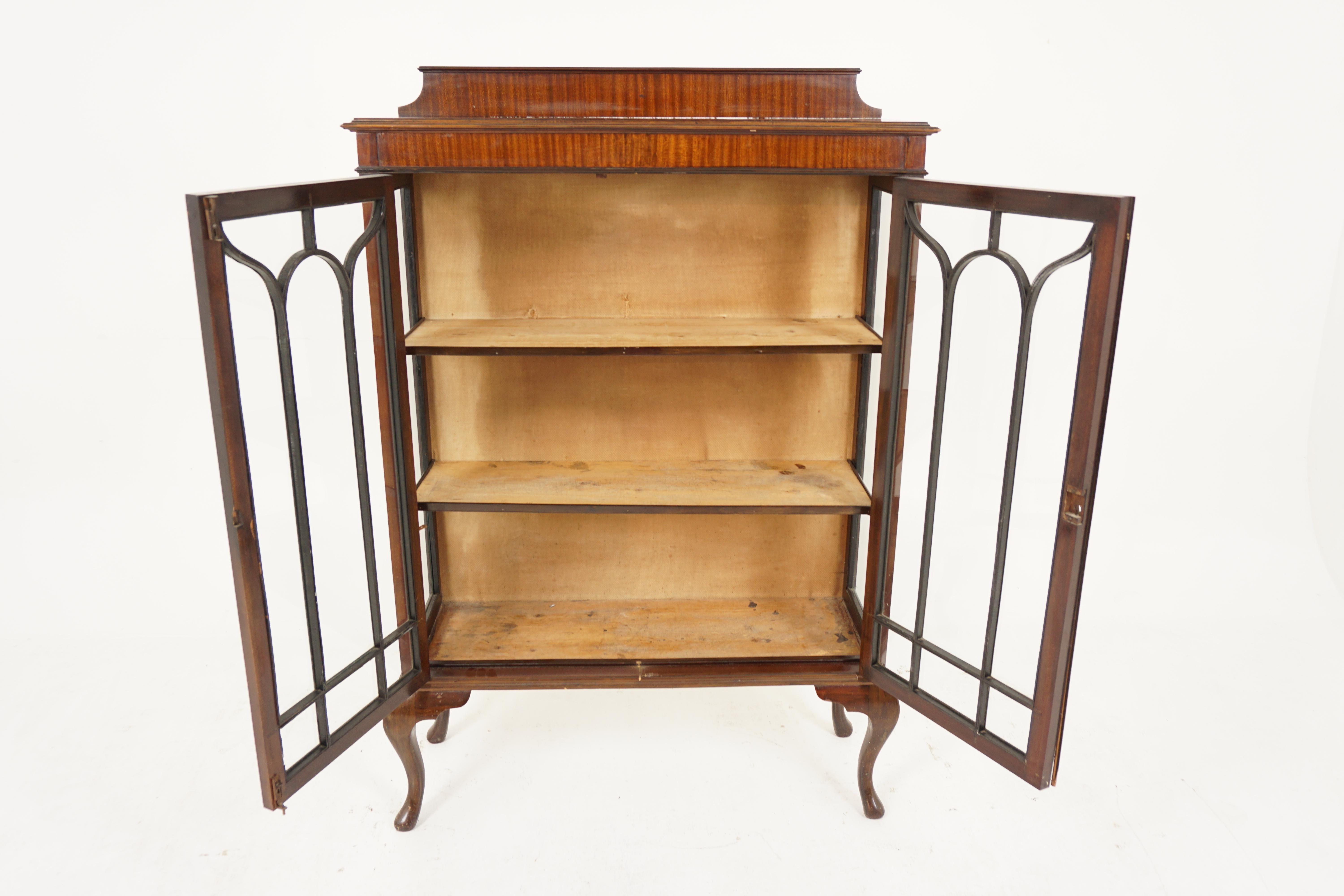 Antique Walnut China Cabinet, Display, Scotland 1920, B2683

Scotland 1920
Solid walnut
Original finish
Rectangular moulded top with gallery at the back
Pair of original glass doors with moulded front open to reveal two wooden shelves
All