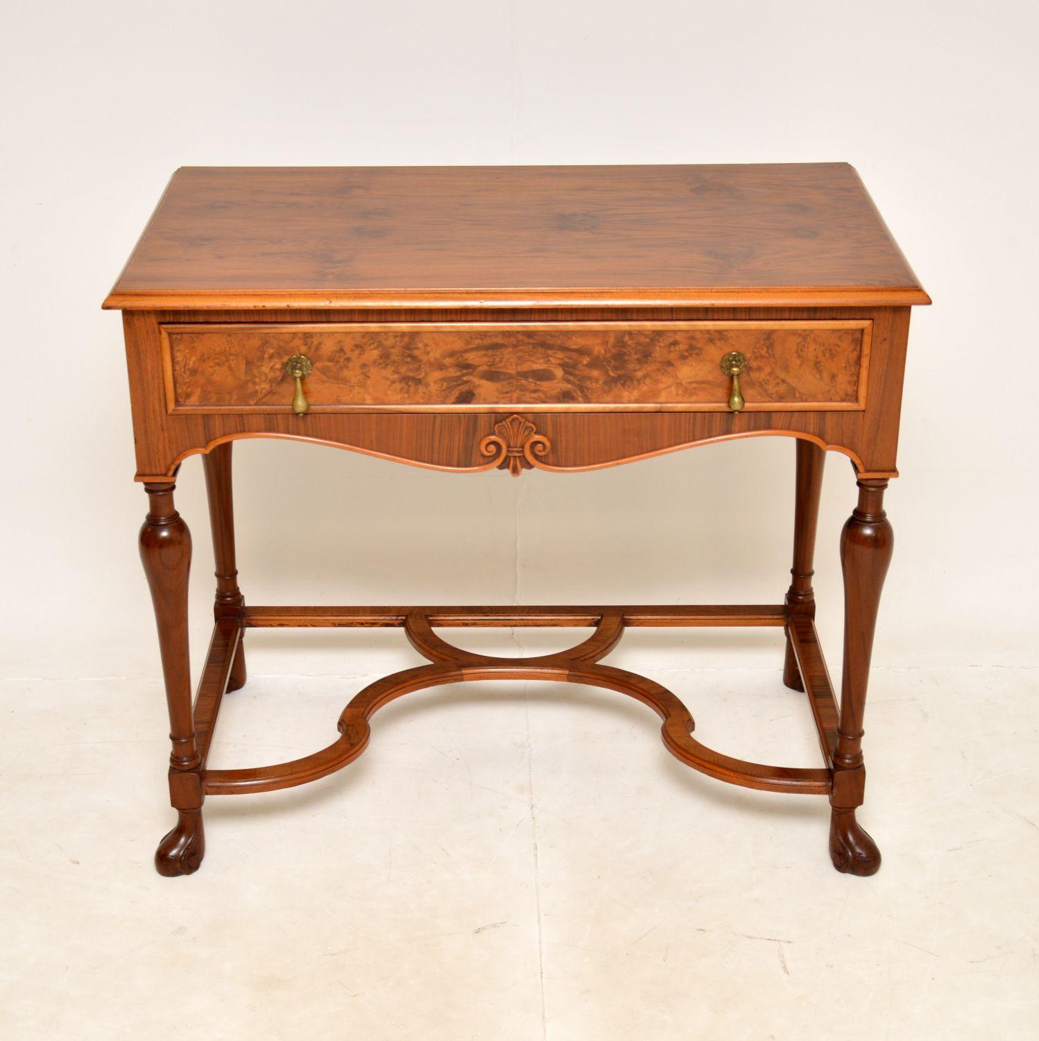 A beautiful and impressive antique console / side table in walnut. This was made in England, it dates from around the 1930’s period.

It is of superb quality, with a stunning burr walnut drawer front and lovely figured walnut top and sides. The legs