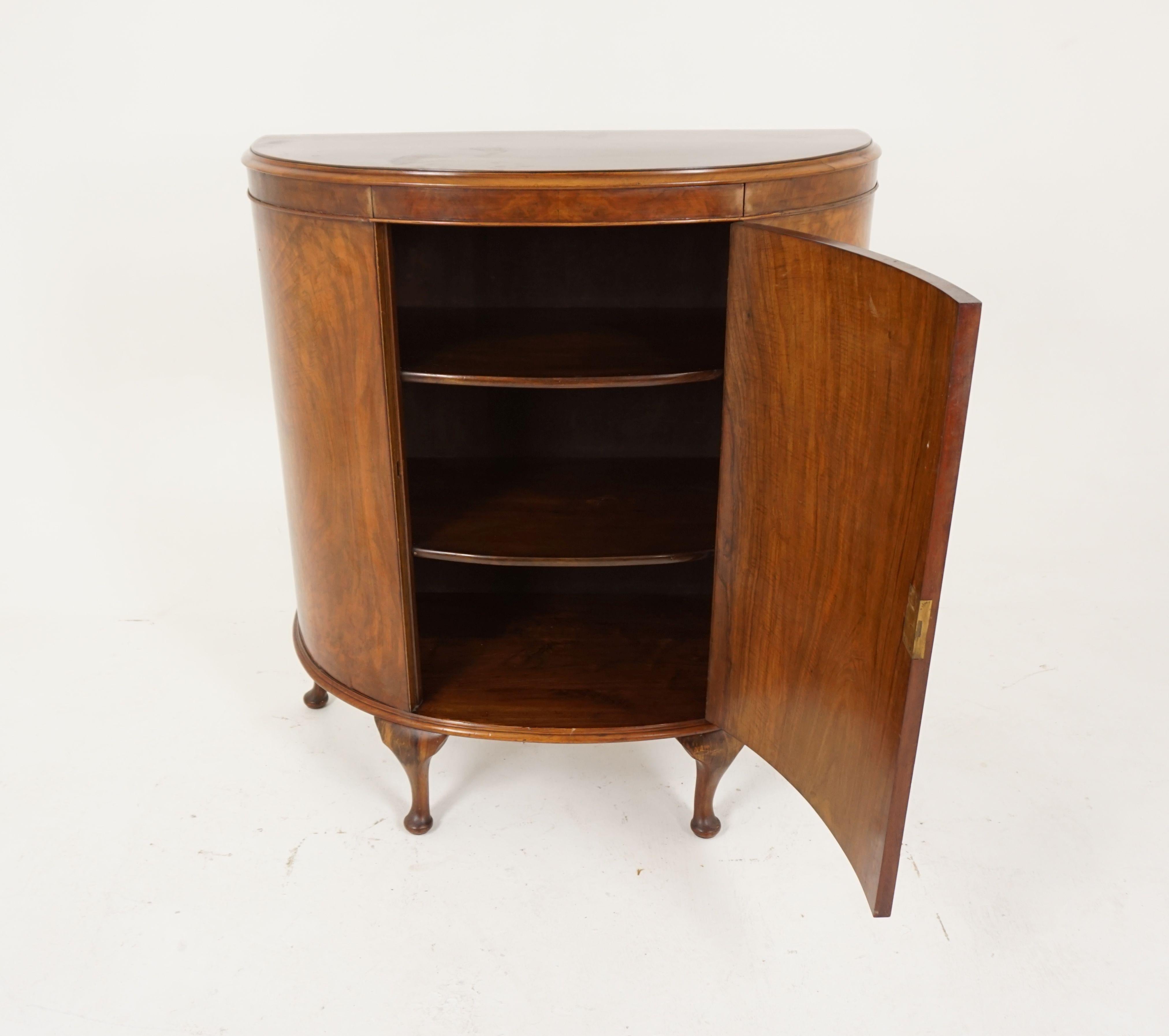 Early 20th century antique walnut demilune drink cabinet, bar cabinet, Scotland 1930, B1954

Scotland, 1930
Solid walnut and veneer
Original finish
Solid walnut top with moulded edge
One central door below which opens to reveal a single