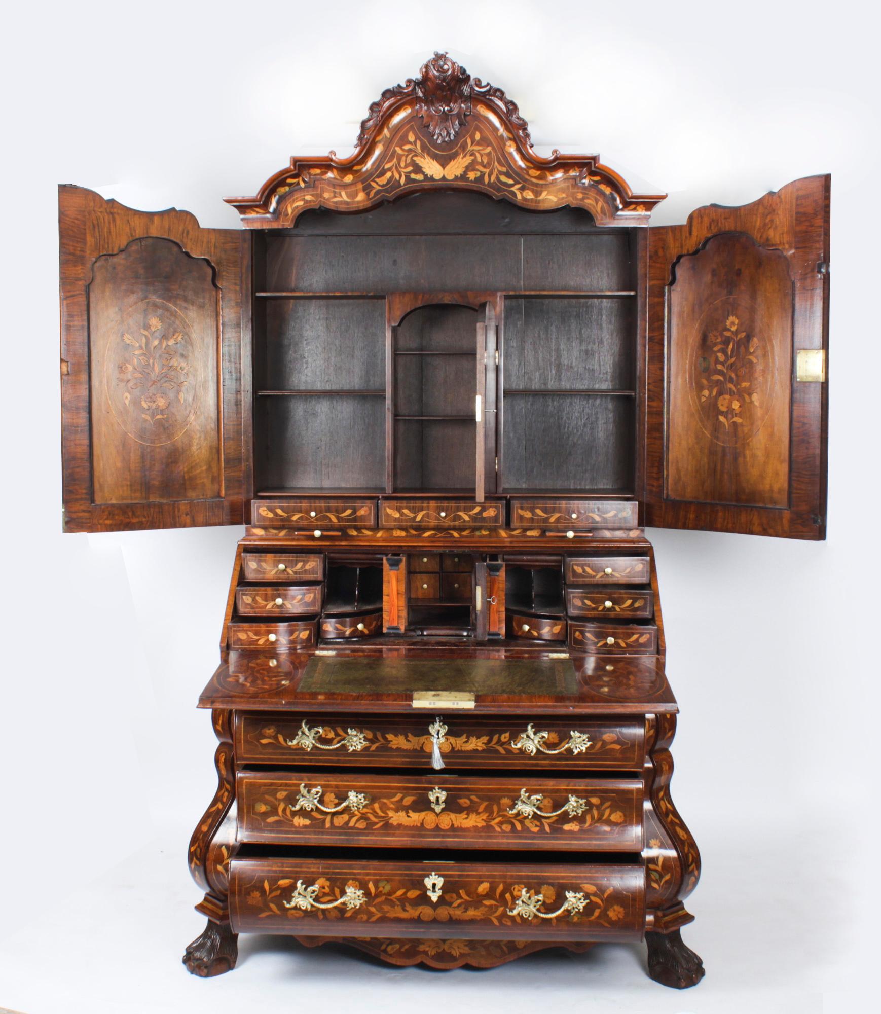 This is an important antique Dutch walnut and marquetry bureau bookcase, circa 1780 in date.
 
It has been made from the finest burr walnut with fabulous marquetry decoration depicting vases of flowers, exotic birds, ribbons, floral bouquets and
