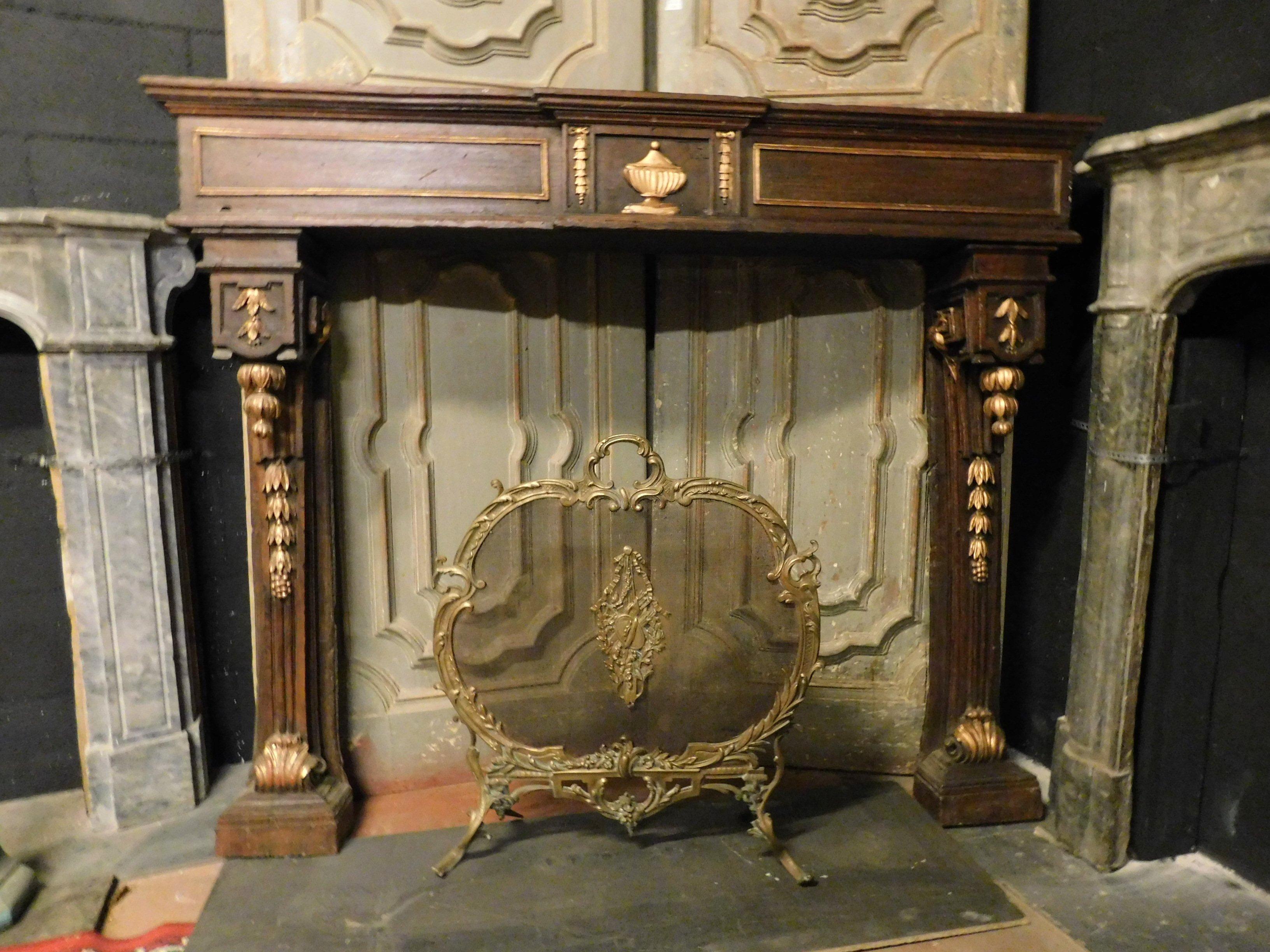 Antique fireplace mantel in walnut with cornucopias decorations in richly gold, hand carved, decorations, original gilding, in perfect Louis XVI style, produced in the 18th century in Italy for the local palace.
High quality walnut, easy to set and