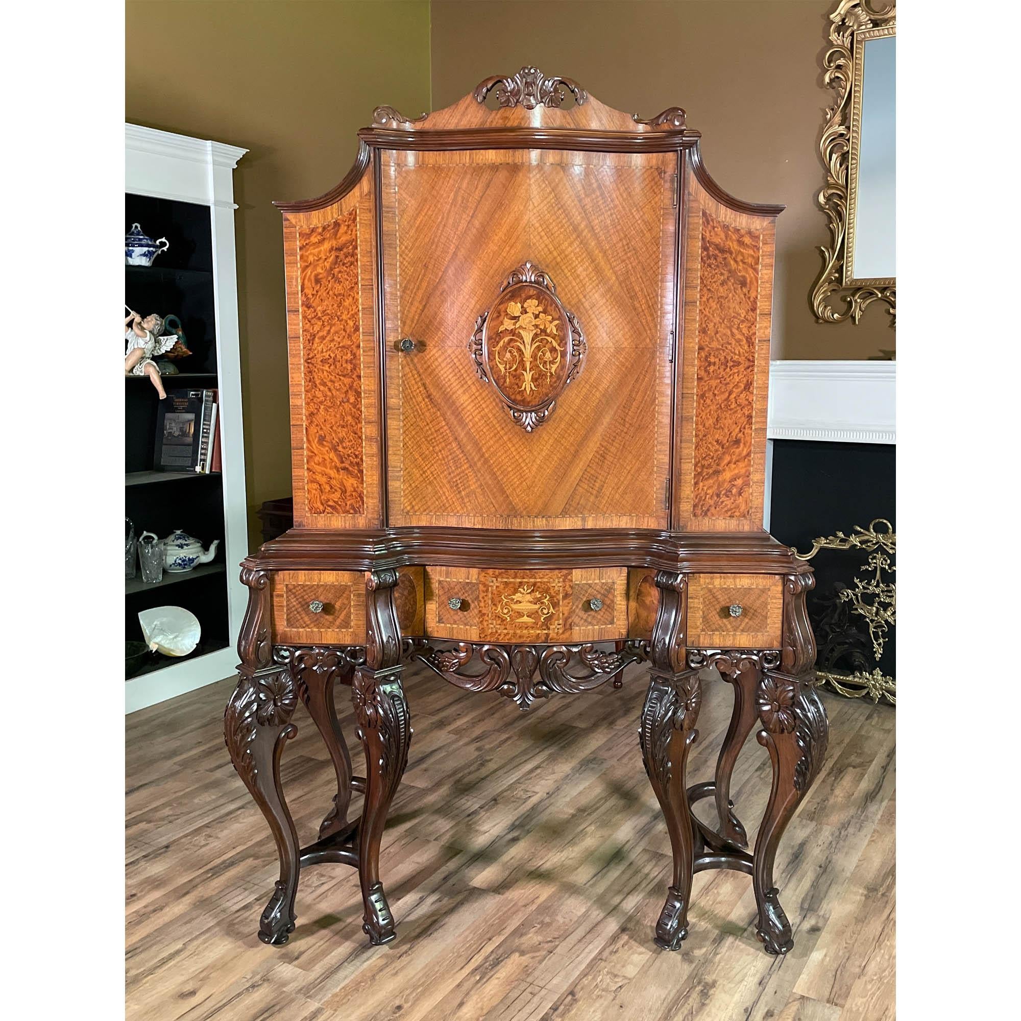 From Niagara Furniture, an Antique Walnut Inlaid China Cabinet in overall great original condition.

Finely crafted and incredibly detailed this beautiful Antique Walnut Inlaid China Cabinet has everything one could ask for as a focal point for the