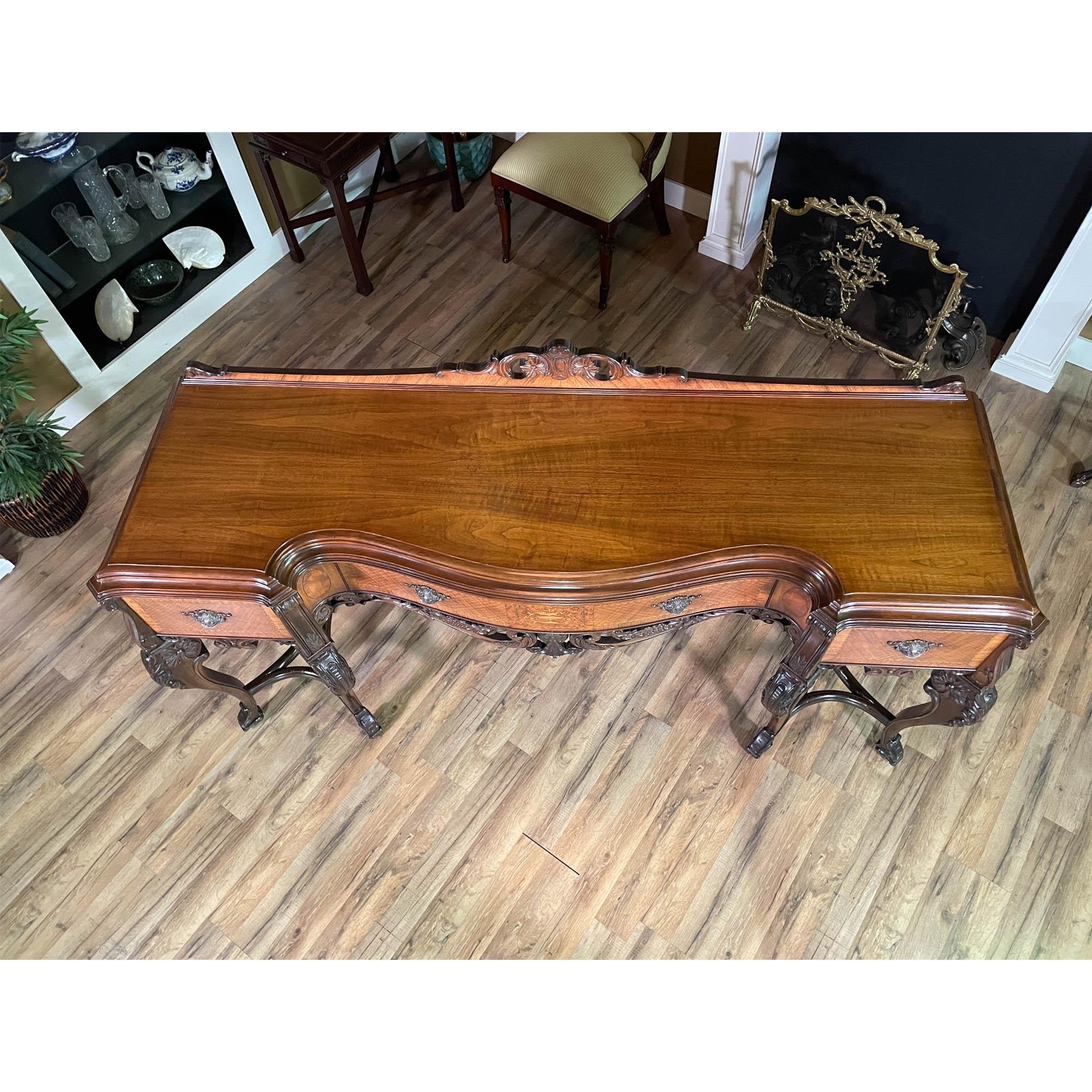 From Niagara Furniture, an Antique Walnut Inlaid Sideboard in overall great original condition.

Both large and incredibly detailed this beautiful Antique Walnut Inlaid Sideboard has everything one could ask for as a focal point for the dining room.
