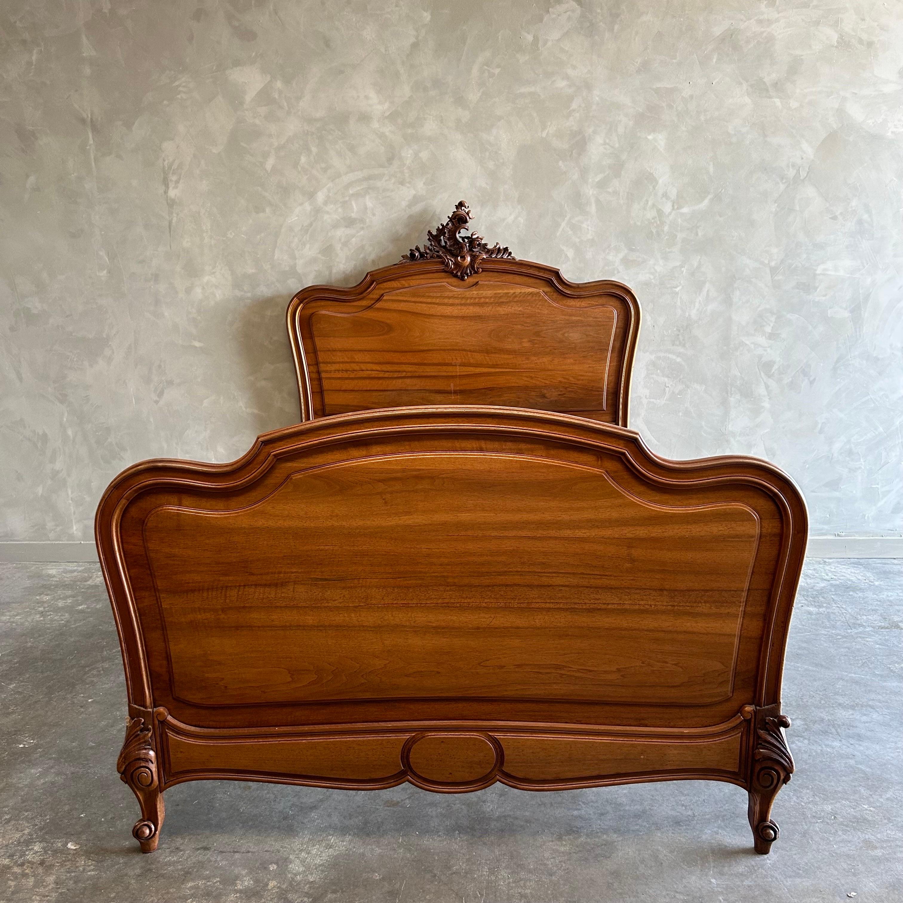 Antique Walnut Carved Full size French bed 
Headboard, footboard with metal rails. (original rails not available)
Overall size: 58”w x 81”d x 61”h
Footboard: 39”h. 
Inside dimensions : 54”w x 76”d (US full size mattress)