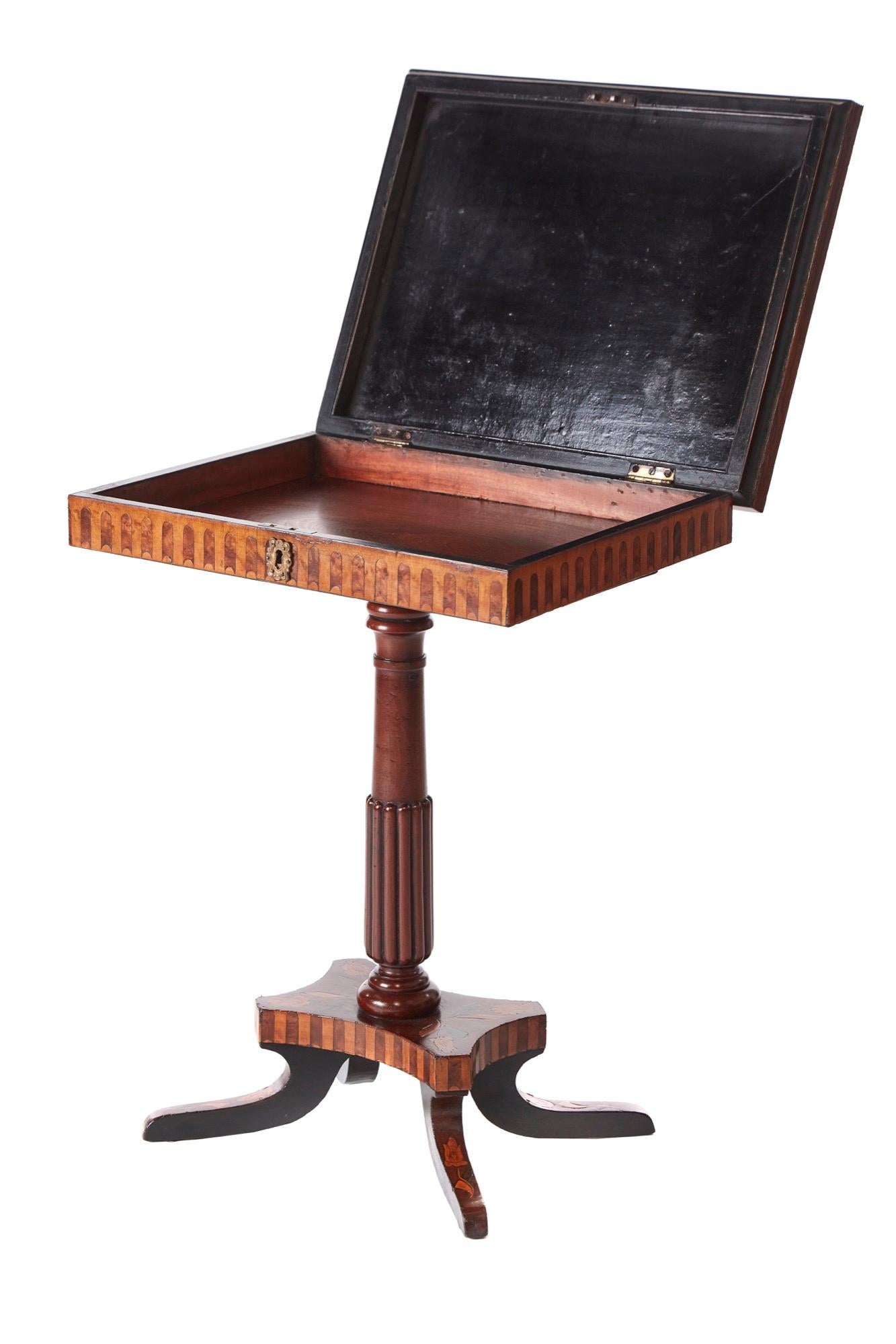 Antique walnut marquetry inlaid lamp table, having a lovely walnut marquetry inlaid lift up top, inlaid frieze, supported by a turned reeded column, standing on a inlaid shaped platform base with four marquetry inlaid sabre legs
Lovely color and