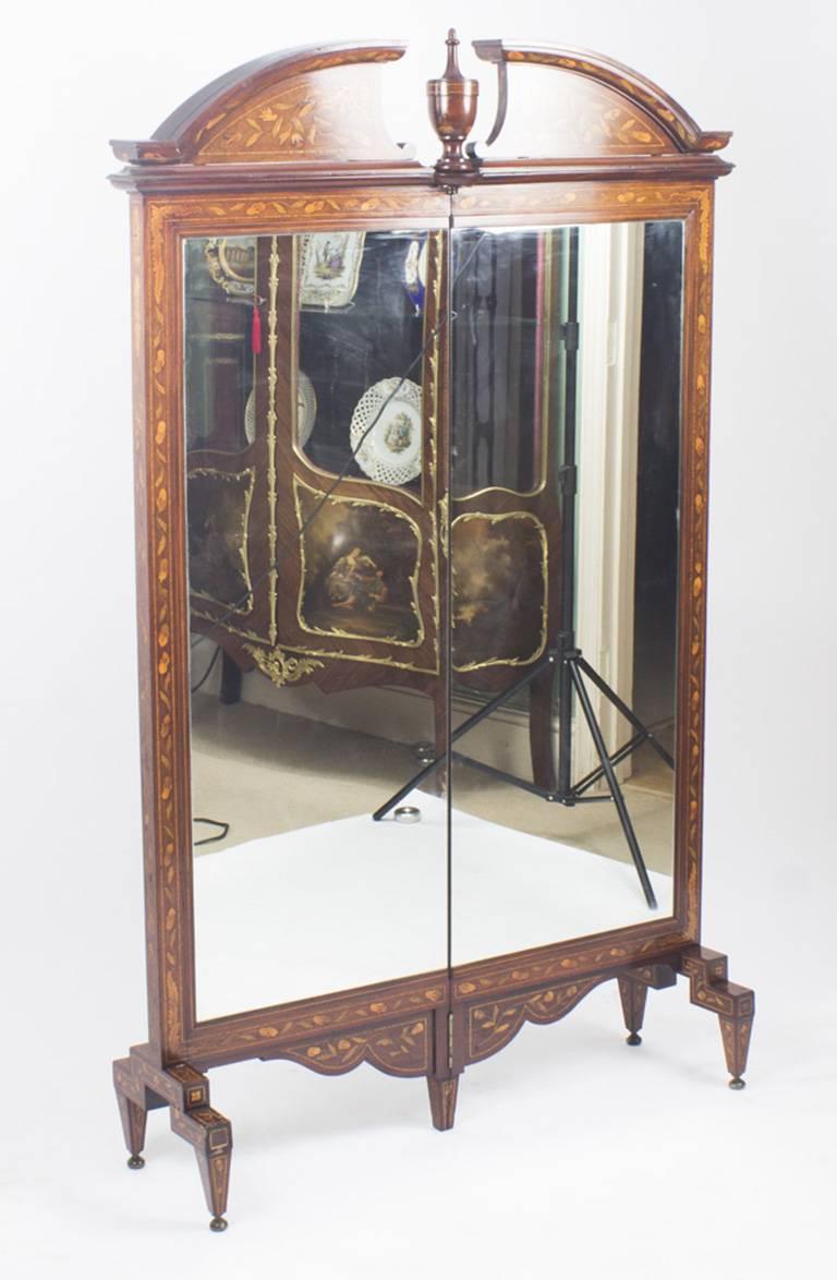 An unusual fine quality Antique Dutch walnut marquetry screen / cheval dressing mirror, circa 1830 in date.

The double folding screen features a rectangular shaped mirror plate with floral marquetry frame, the reverse features marquetry panels