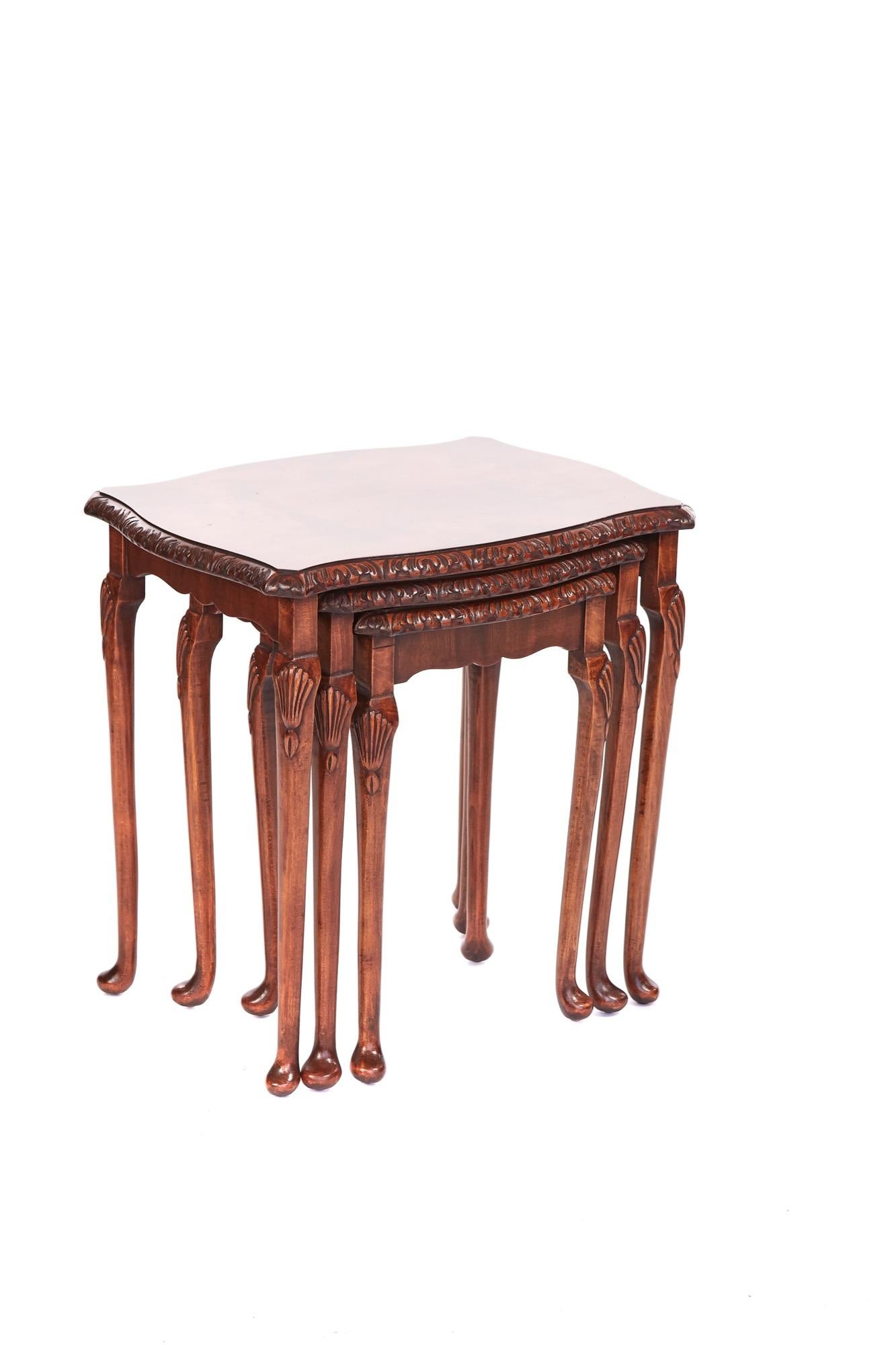Antique Walnut Nest Of Three Tables having lovely carvings around the edge of the table tops supported by cabriole shaped legs with fantastic shell carvings to the top and standing on pad feet.

H: 55cm W: 56cm D: 42cm.
