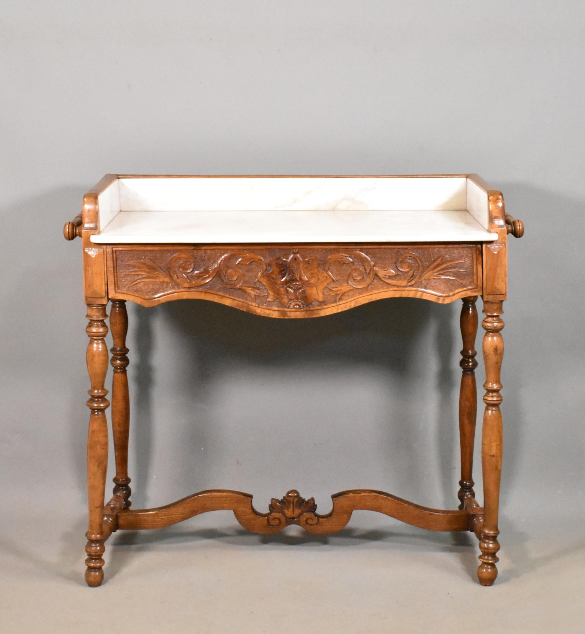 Antique Walnut & Oak Washstand Louis Philippe 19th Century 

This very attractive French Walnut and Oak Washstand is unusual in that the front is made of walnut and the back is made of oak. 

It has a white variegated marble top and surround and
