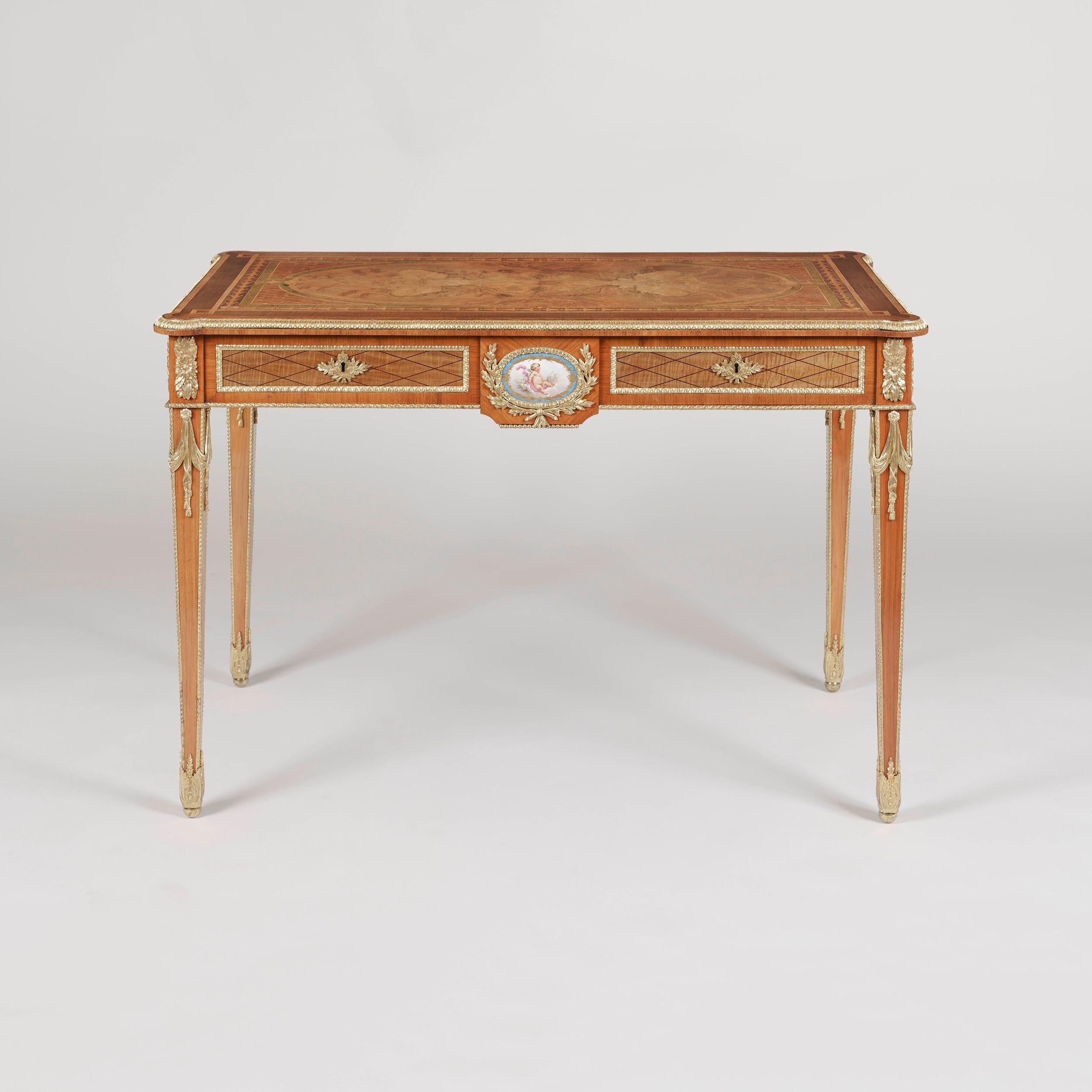 A fine centre table firmly attributed to Holland and Sons

Of free standing rectangular form, constructed in the manner of the Anglicised Louis XVI taste, using Circassian book matched walnut, tulipwoods, green-stained Sycamore and adorned with