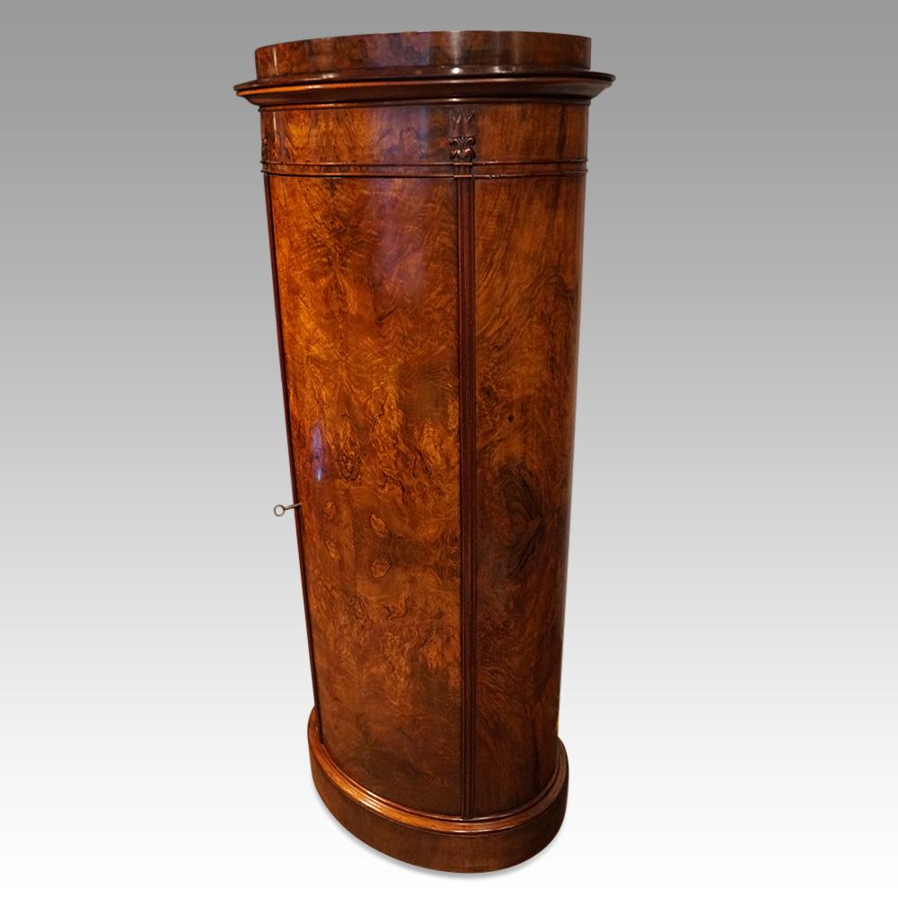 Antique walnut drinks cabinet
This 19thc. bow fronted pillar cupboard was made circa 1830. 
Constructed using the very attractive burr walnut. 
These are known as post-box cabinets as they are the shape of Victorian post-boxes.
The cabinet is fitted