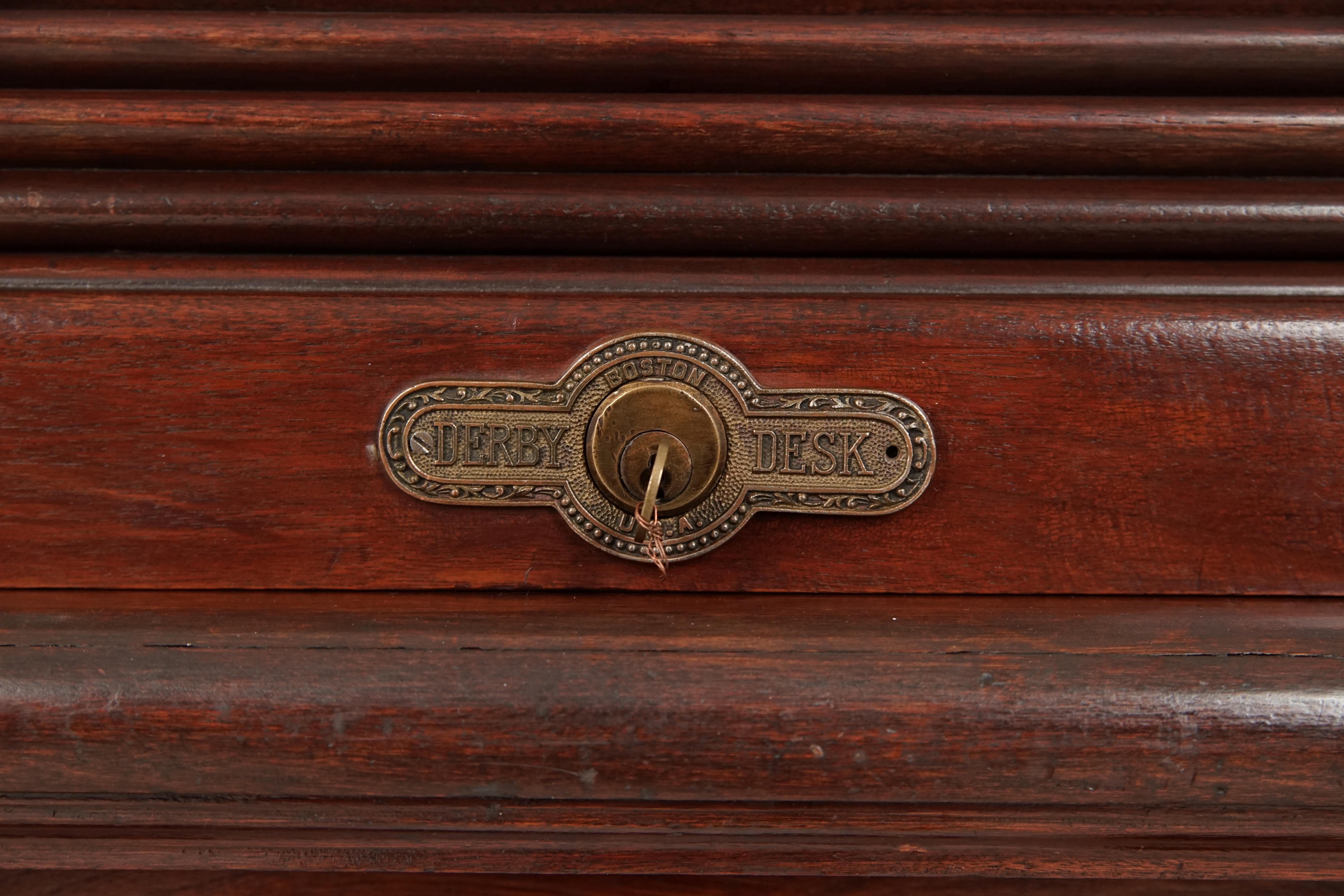 Antique walnut roll top desk by Derby Boston, America 1880, B2750

America 1990
Solid walnut
Original finish
This is the highly desired s-type shape
High back with fitted interior
The desk has folding sides that are detachable
With twelve