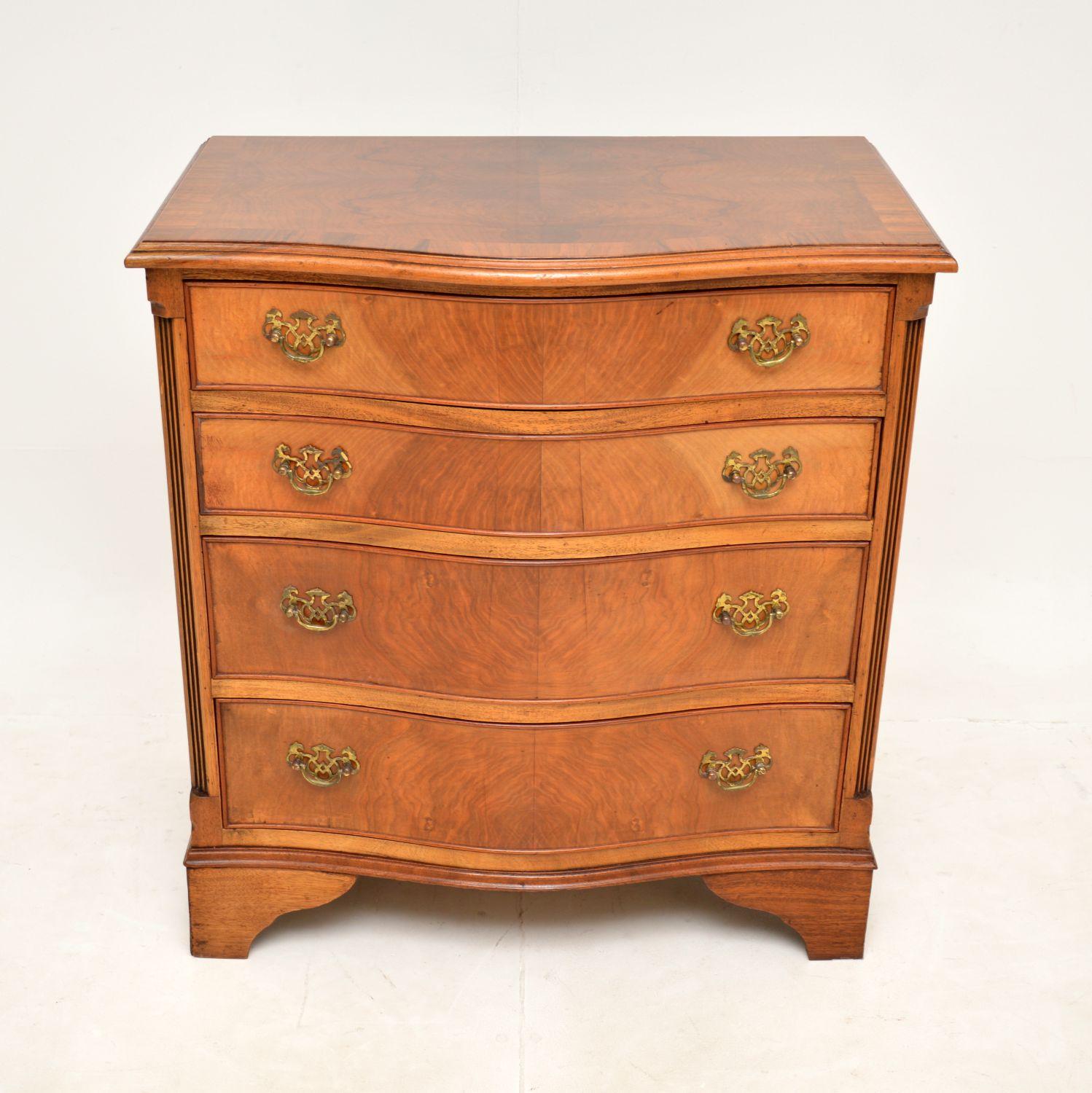 A very well made and useful antique walnut chest of drawers the Georgian style. This was made in England, it dates from around the 1930’s.

It is of lovely quality and is a great size, not too imposing yet offering plenty of storage space. This