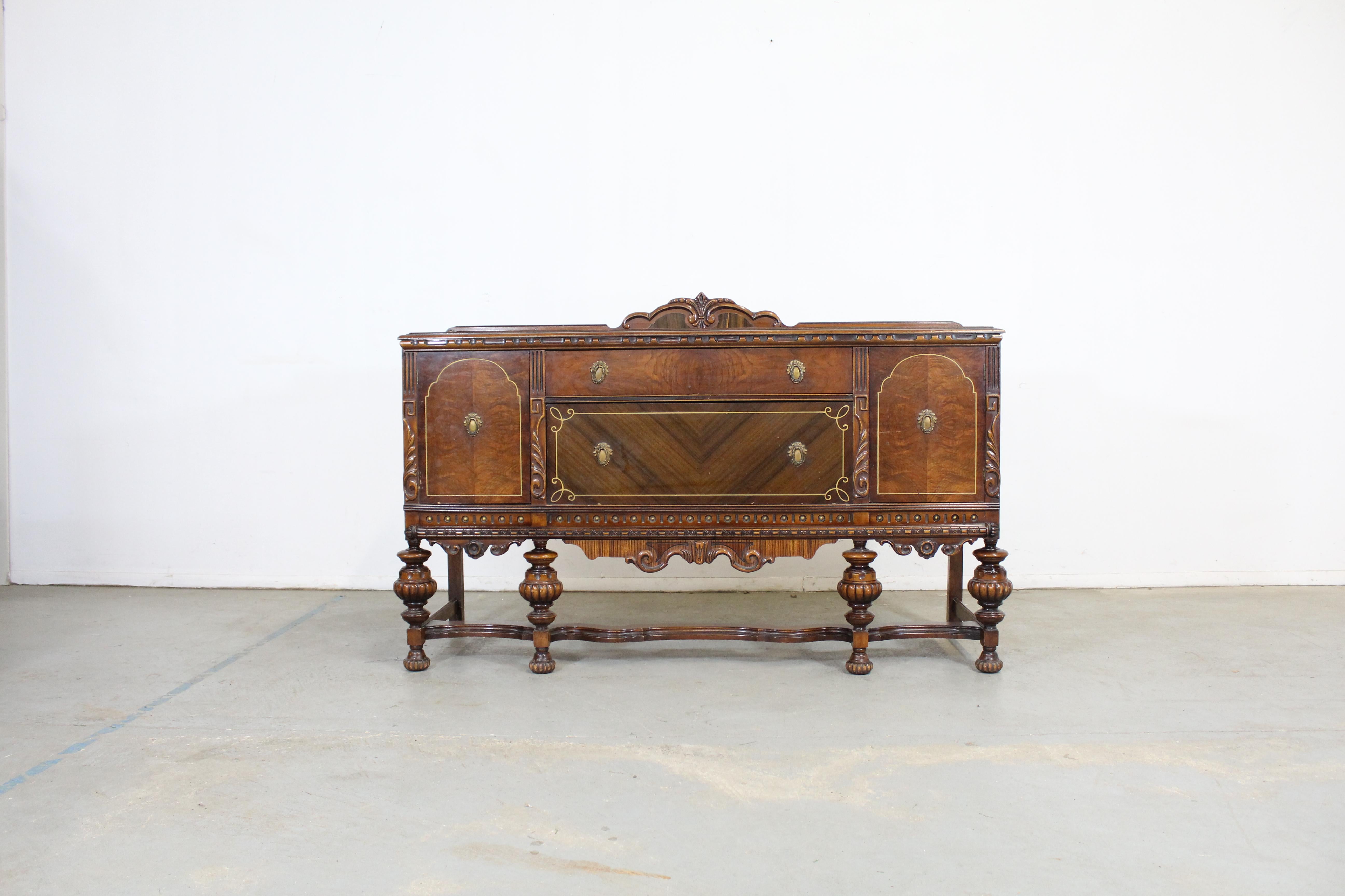 Offered is a antique walnut sideboard/credenza. It is made of walnut, featuring 2 drawers and 2 doors. It is in great condition, shows normal signs of age wear (surface scratches/wear, age wear- see photos), but nothing overly