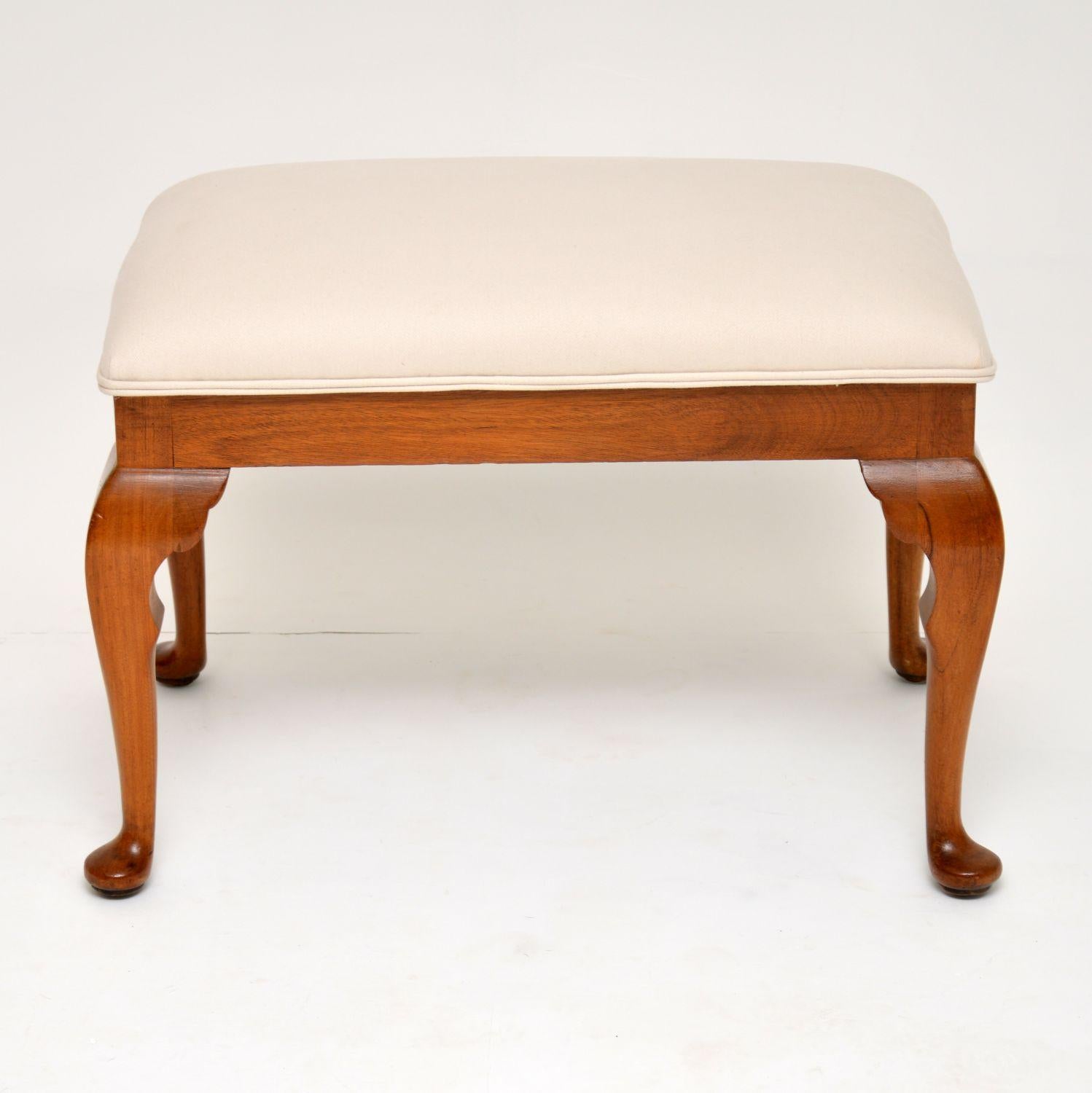 Antique solid walnut Queen Anne style stool in excellent condition, dating from circa 1910s-1920s period. It’s just been French polished and re-upholstered in our regular cream cotton linen fabric.

Measures: Width 28 inches, 70 cm
Depth 17