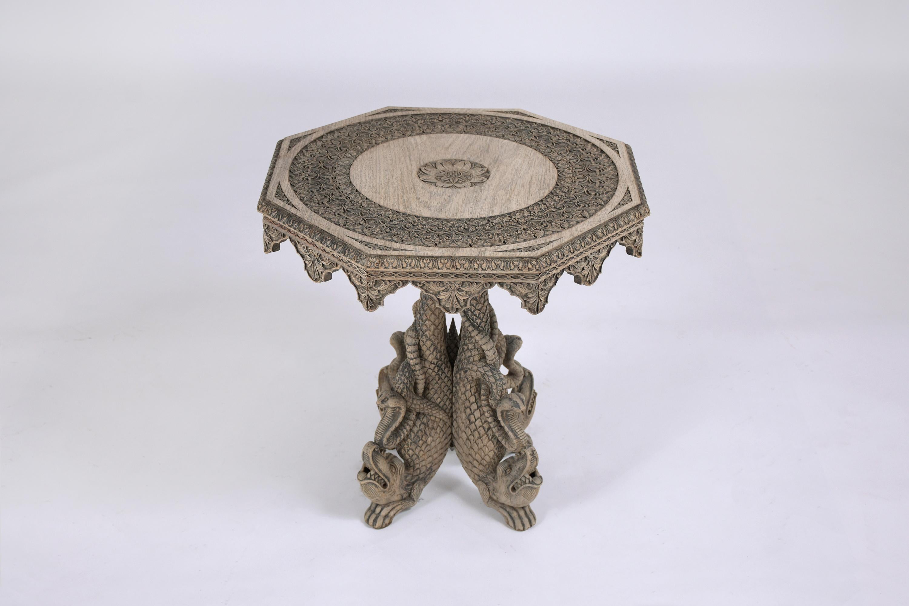 Dive deep into the world of timeless craftsmanship with our exceptional antique side table, hand-crafted from premium walnut wood. Dating back to the early 1900s, this Baroque-inspired end table stands in good condition, echoing the meticulous