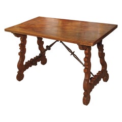 Antique Walnut Table from Spain with Iron Stretchers and Carved Feet, Late 1800s