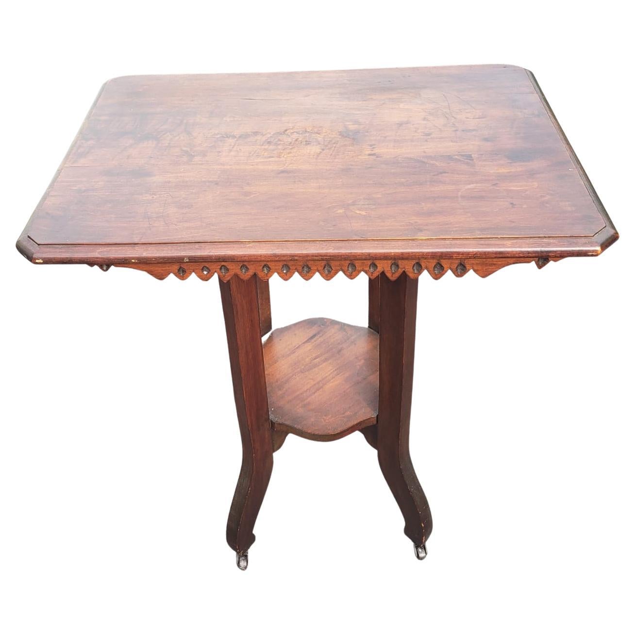 Antique walnut tier tea table side table on wheels, Circa 1910s.
Good vintage condition.
Measures 28.25