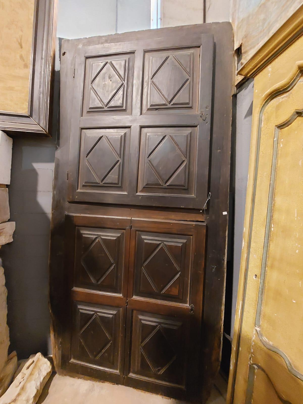 Antique walnut wall placard, cupboard with double body doors, built-in wardrobe with doors carved in precious walnut, lozenge shapes, has a large door above and a door that opens like a book at the bottom, in good condition with some small