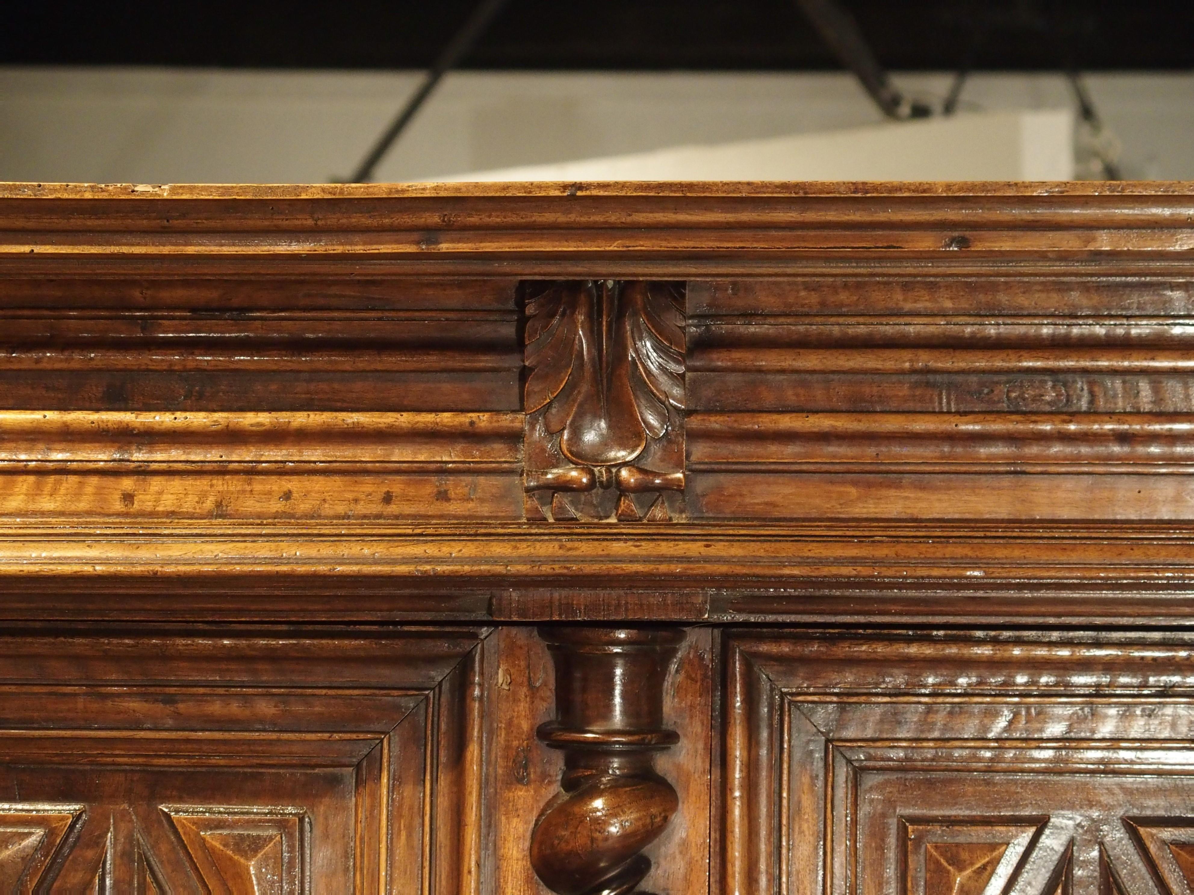 This handsome hand carved walnut buffet a deux corps comes from Southwestern France, circa 1690.

Literally, a buffet deux corps means “two body buffet”. A deux corps is a two-tiered cabinet where the upper section sits on top of the lower