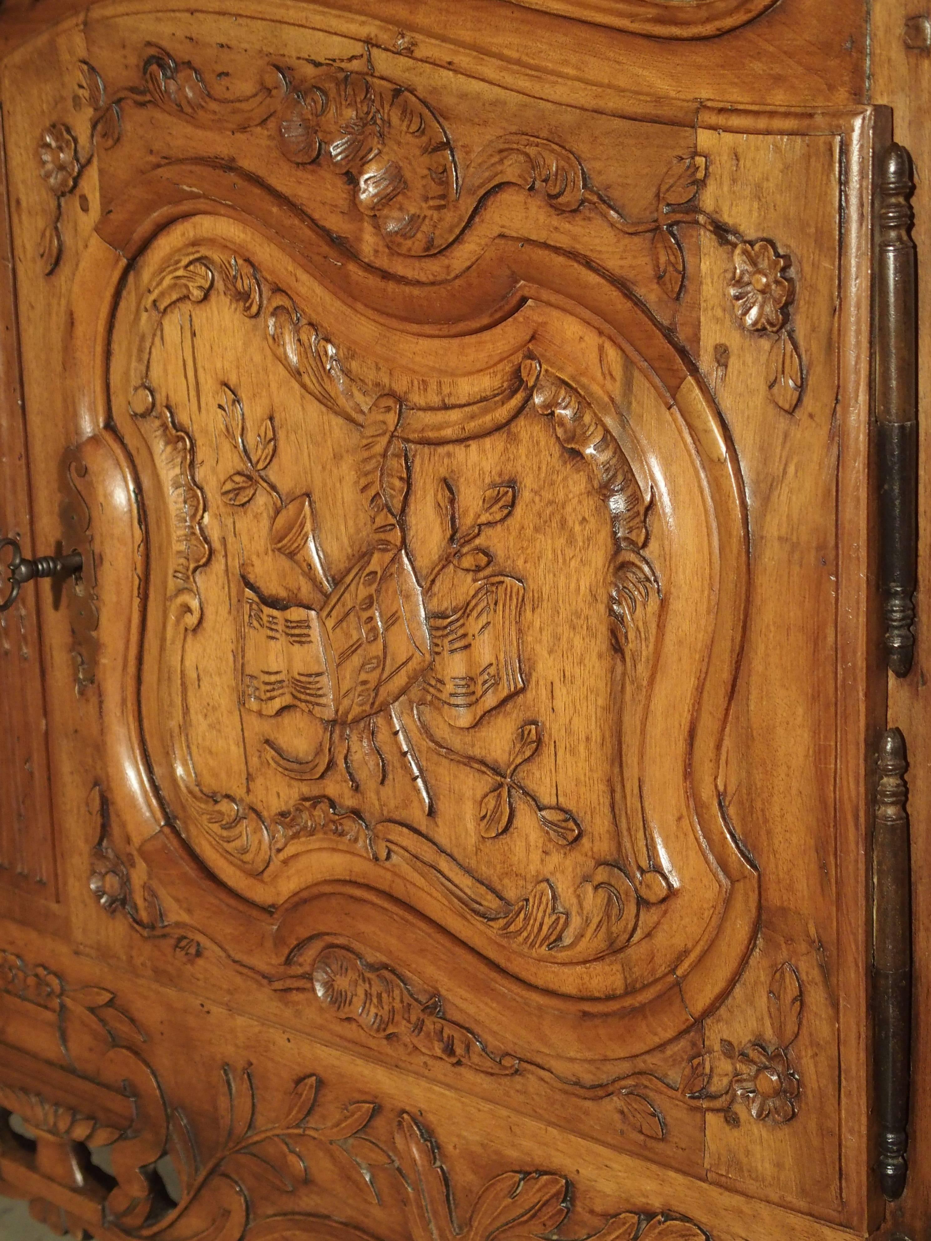 From Provence, this French walnut wood buffet is from the 1800s. The abundant carvings, pierced apron and motifs are all typical of furnishings from the South of France during the 18th-19th century. While typically French and Provencale, the style