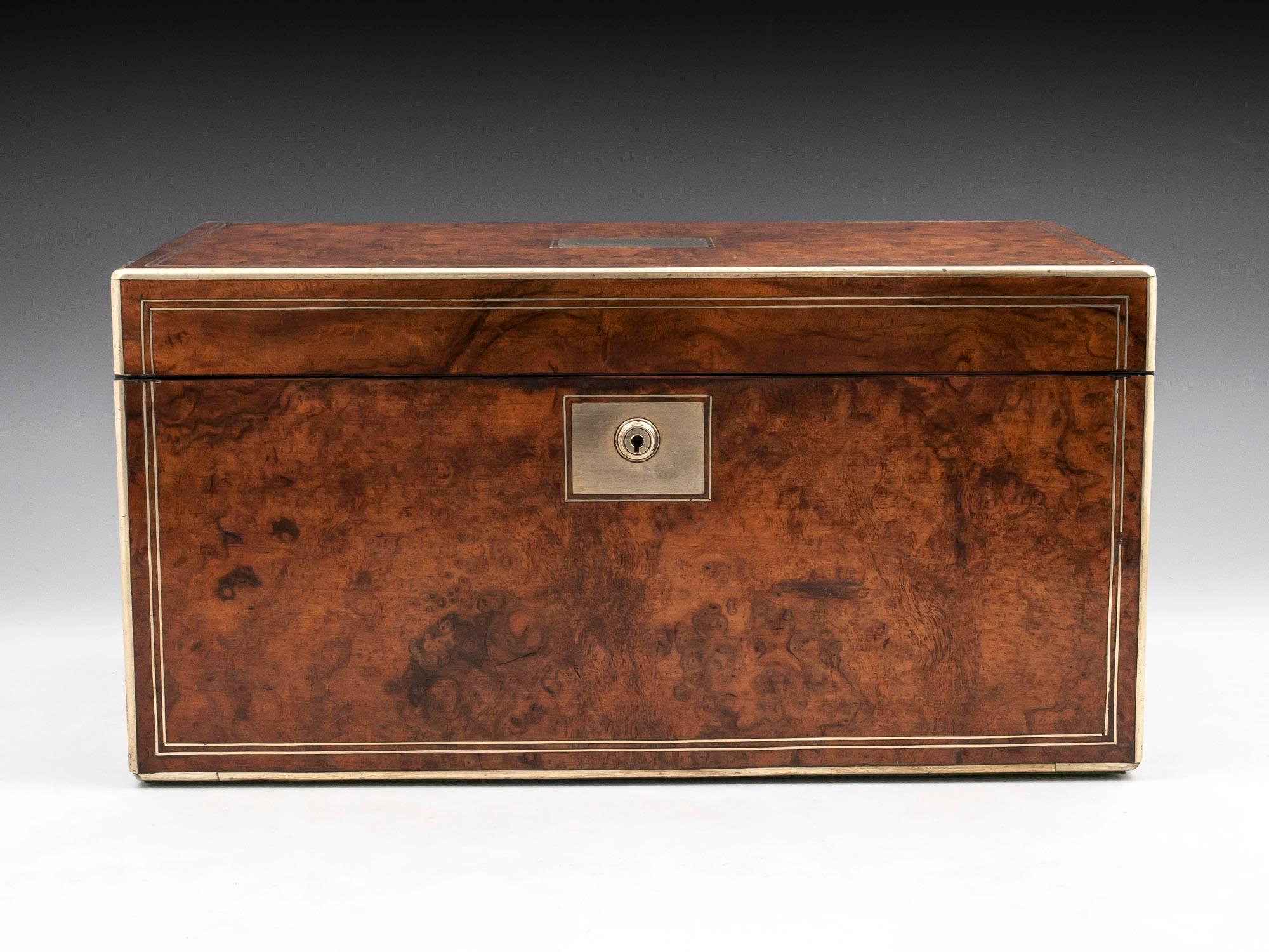 Antique writing box veneered in lovely figured burr walnut with brass edging and double stringing, with a large vacant brass initial plate on the top and matching lock escutcheon, contains two secret compartments one with three drawers and another
