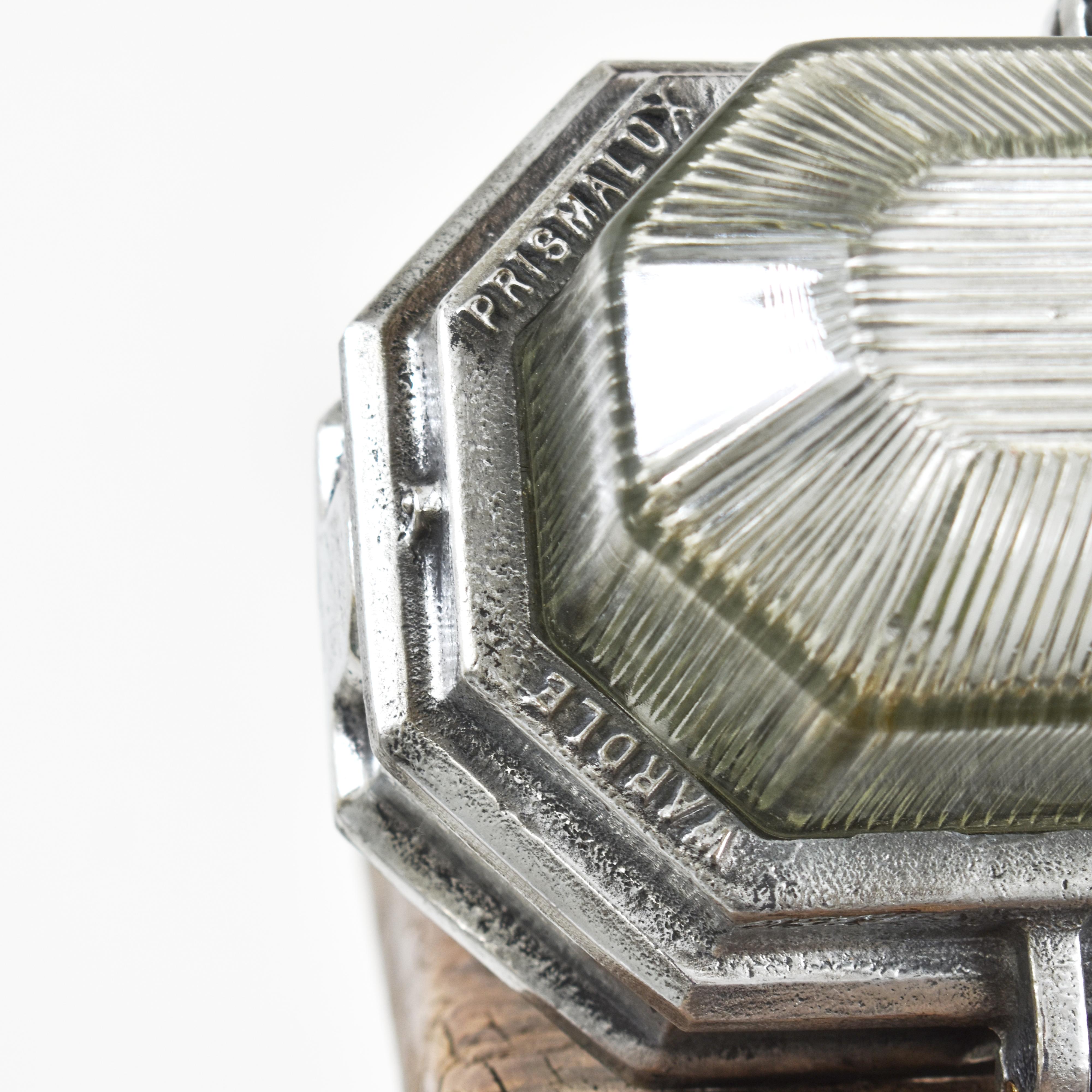 Industrial Wardle Prismalux Bulkhead Wall Light

Original British industrial prismatic bulkhead light by ‘Wardle’. Circa 1950. Linear prismatic glass lens located within two part brushed metal housing with cast makers mark ‘Wardle Prismalux.’