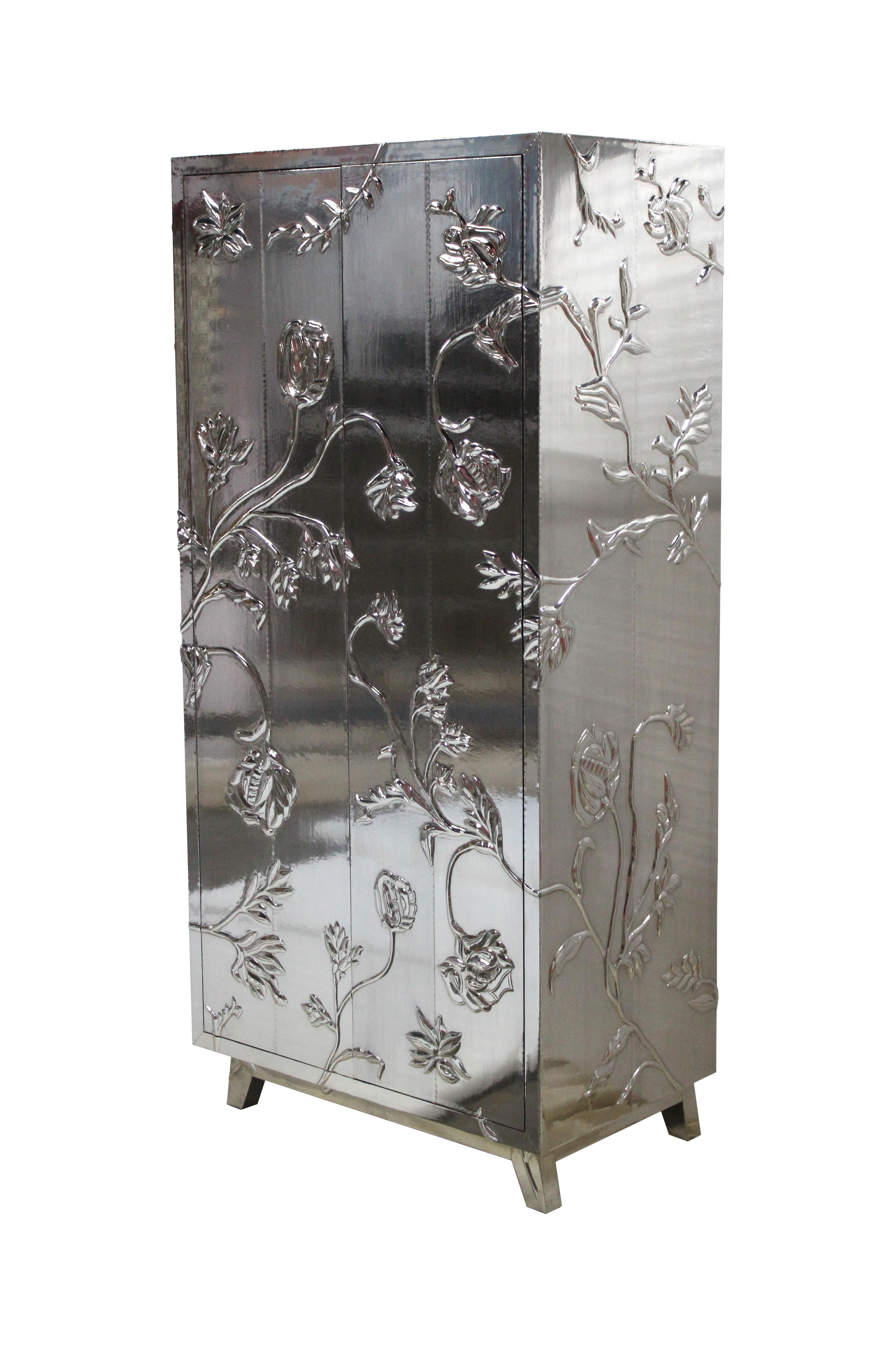 Antique wardrobe and armoire in floral white bronze clad, handcrafted in India is Inspired by the floral motifs used in the paintings of palaces of Rajasthan. One of the bestselling wardrobes and armoires of Stephanie Odegard 's case pieces and