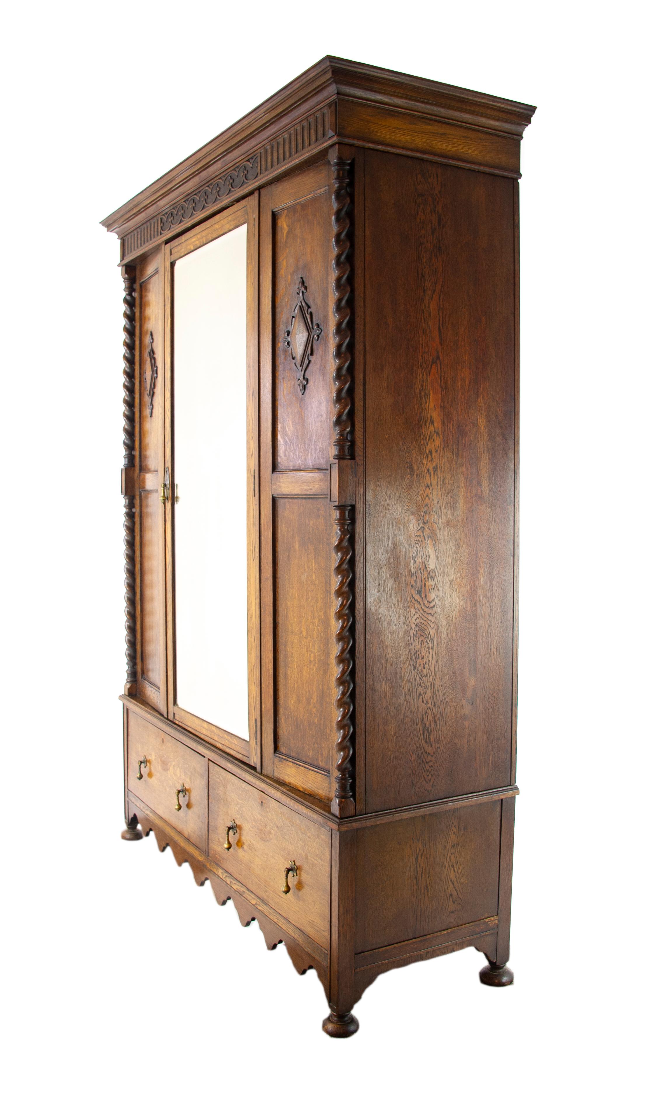 Antique wardrobe, carved oak armoire, barley twist, Scotland, 1910. Antique furniture, B1286

Scotland, 1910
All original condition
Carved cornice above
Single bevelled mirror door below
Flanked by a pair of carved panel sides
Thick barley twist