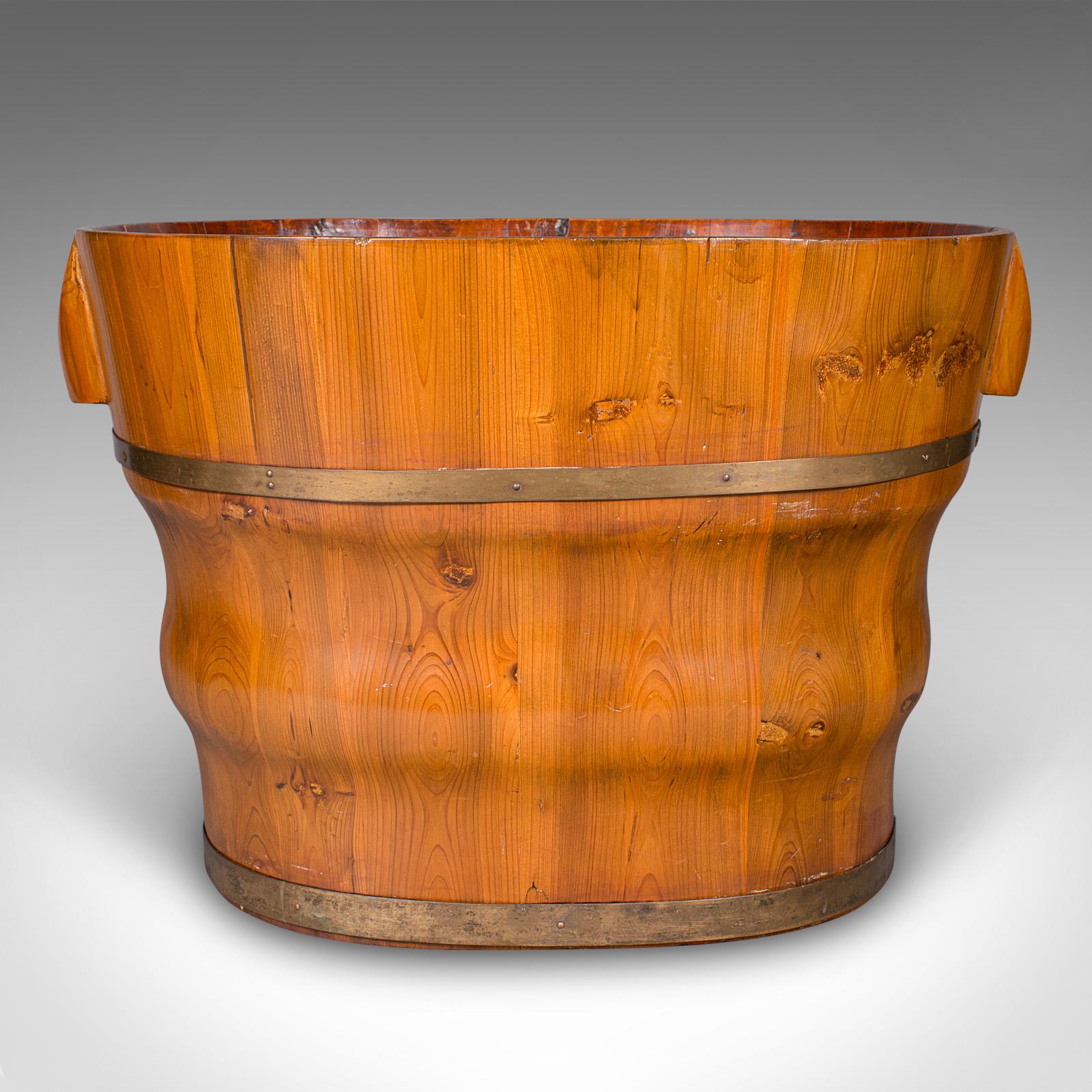 This is an antique waste paper basket. An Austrian, cedar and brass bound bathroom or home office bin, dating to the late Victorian period, circa 1900. Handsome and practical, it presents a fine balance of utility and decorative charm.

Select cedar