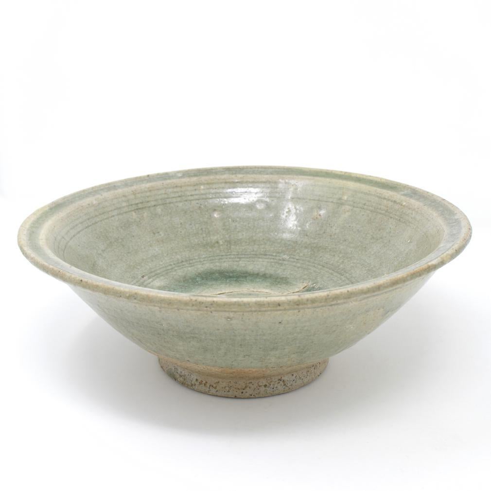 Glazed Antique “Waster” Celadon Bowl, Sawankhalok kilns, Thailand, 14th/15th century. For Sale