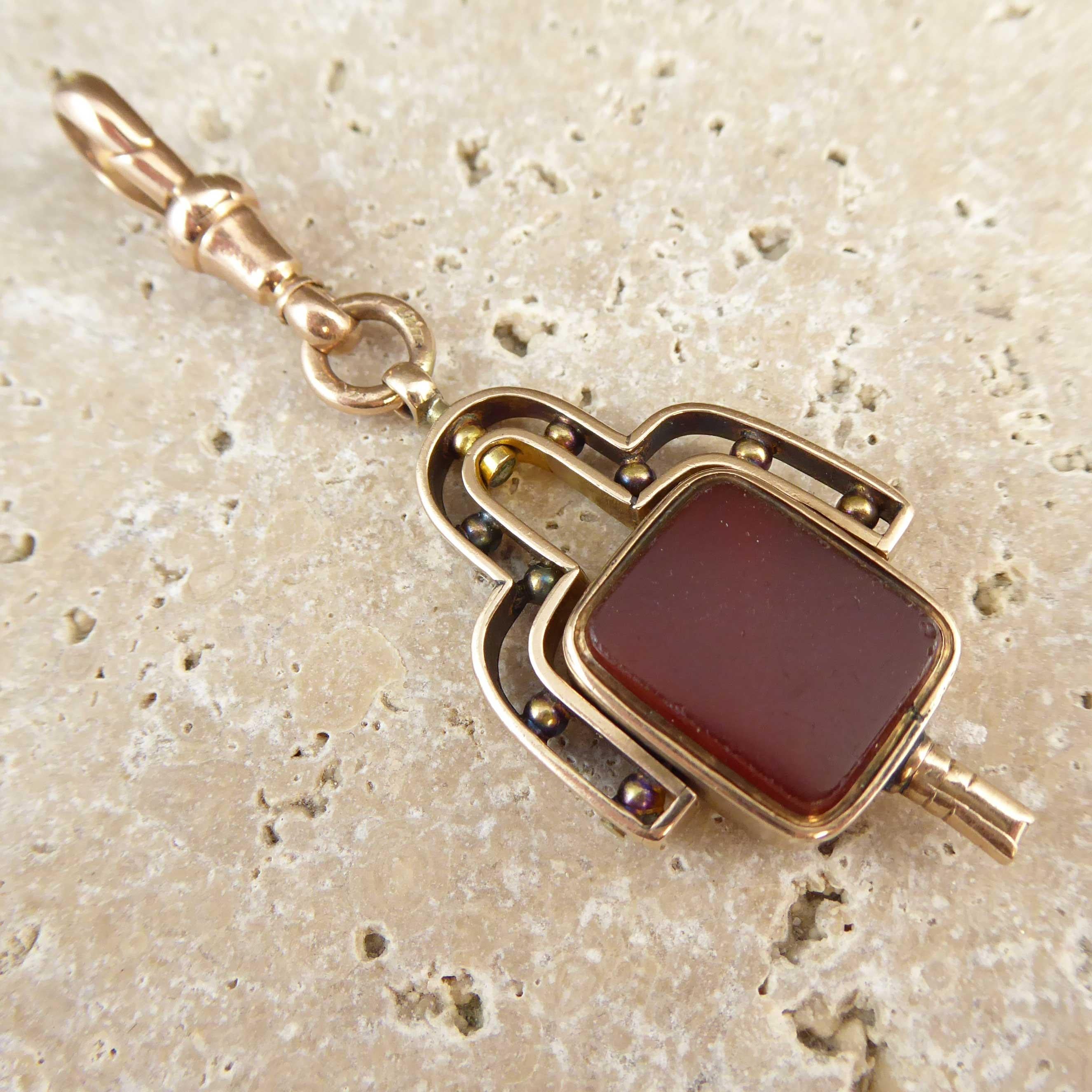 A watch key fob dating from circa 1910s set with the typical cornelian to one side and blood stone to the other.  This lovely example has a rather grand gold frame, the design of which would appear to be veering towards the style of the 1920s. 