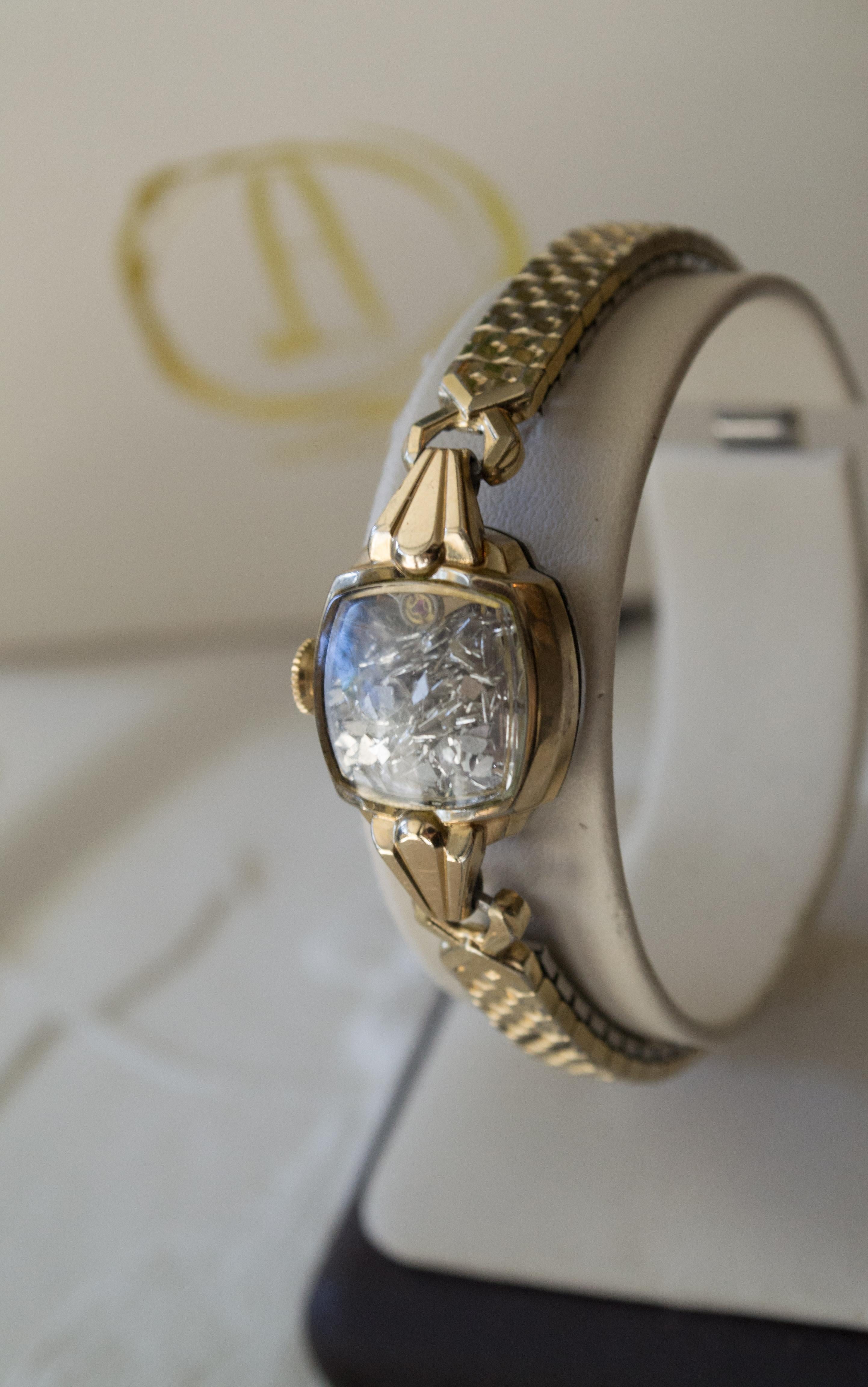 The Fairydust band is a non-functioning antique watch  a symbol, a talisman,
to hold the intention of staying present, neither dwelling in
the past nor looking toward the future. The fairydust inside
are mirror shards, a shattering of the