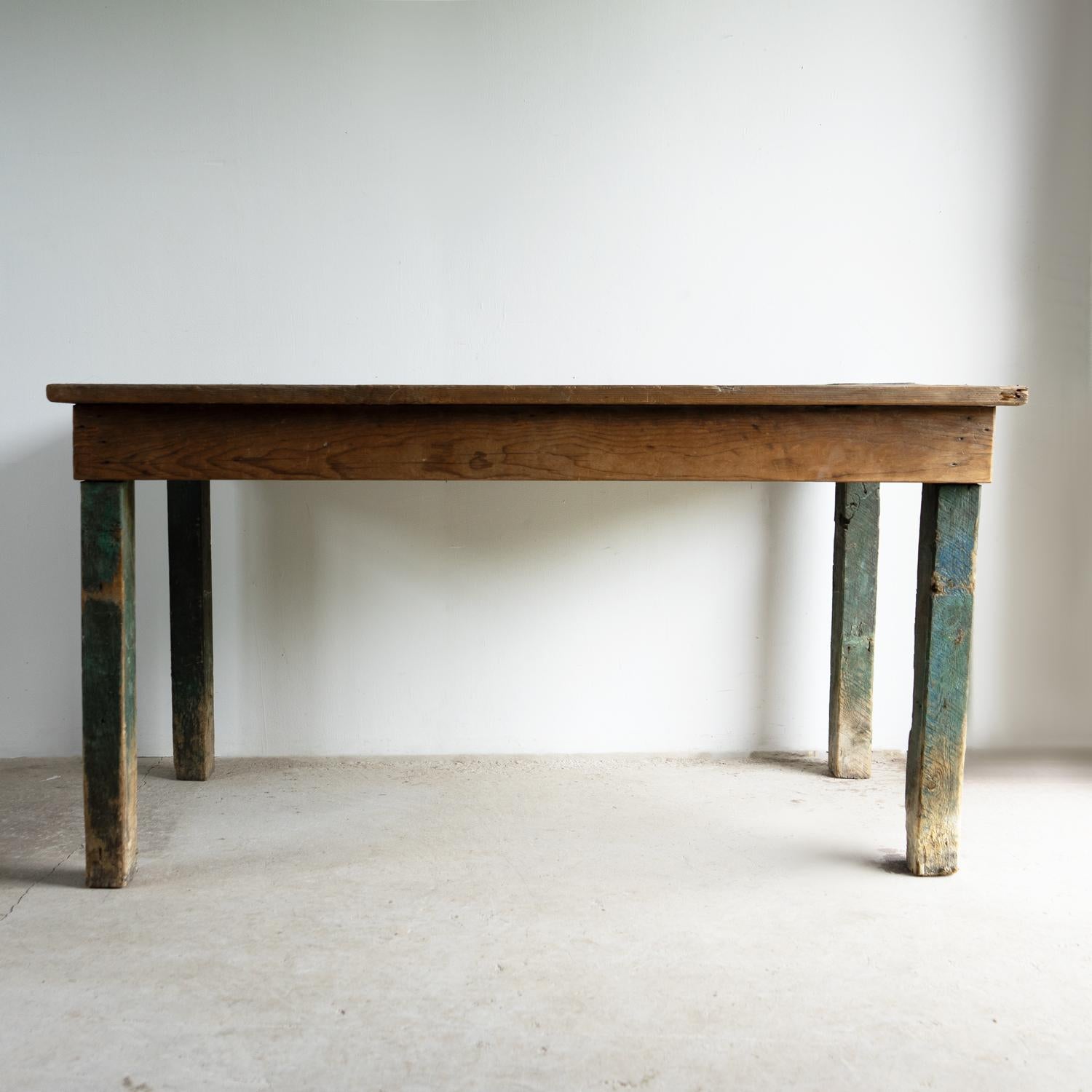 ANTIQUE TABLE

Originally a work table from a textile mill in Northern England.

Of fairly rudimentary construction in pine with square legs, casting a simple and stylish silhouette.

Naturally worn and weathered from years of use, the top to a