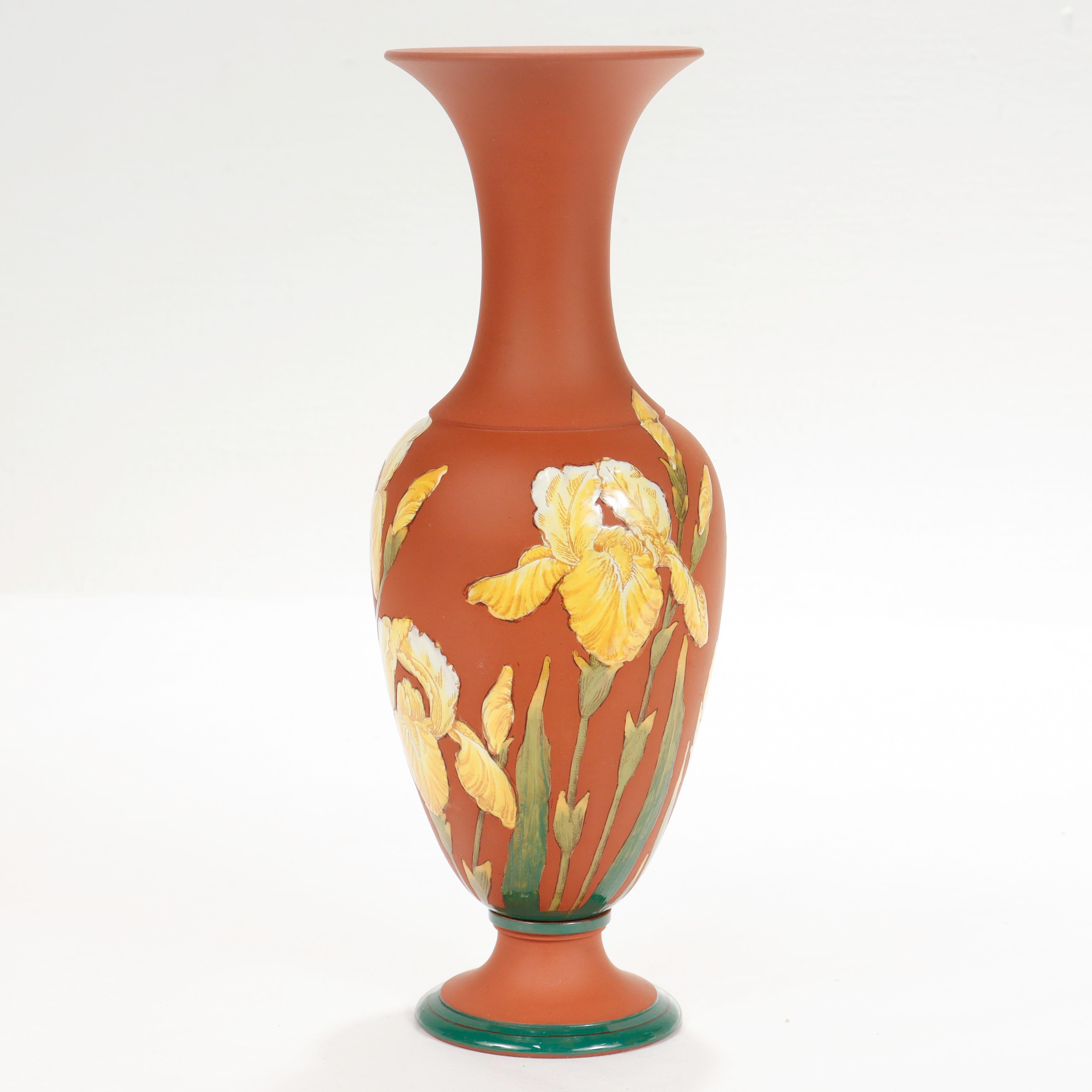 A fine antique enameled Wedgwood vase.

With a terracotta colored Rosso Antico baluster form body.

Decorated in a yellow enameled Kentlock Iris pattern around the circumference.

Simply an exceptional vase!

Date:
20th Century

Overall