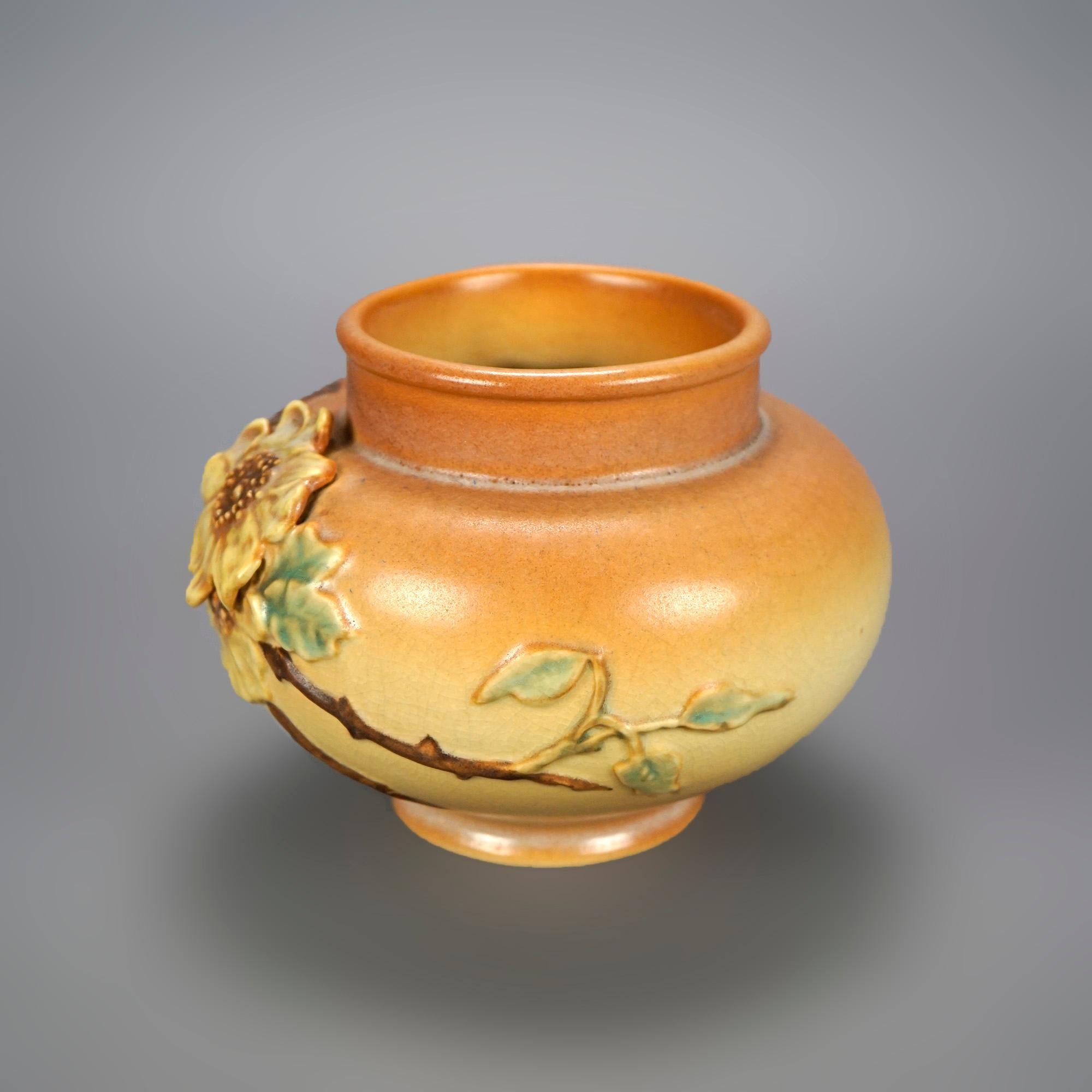 An antique vase by Weller offers art pottery construction in bulbous form with dogwood flower design, maker signed on base as photographed, c1940

Measures- 5.75'' H x 7.25'' W x 7.25'' D.

Catalogue Note: Ask about DISCOUNTED DELIVERY RATES