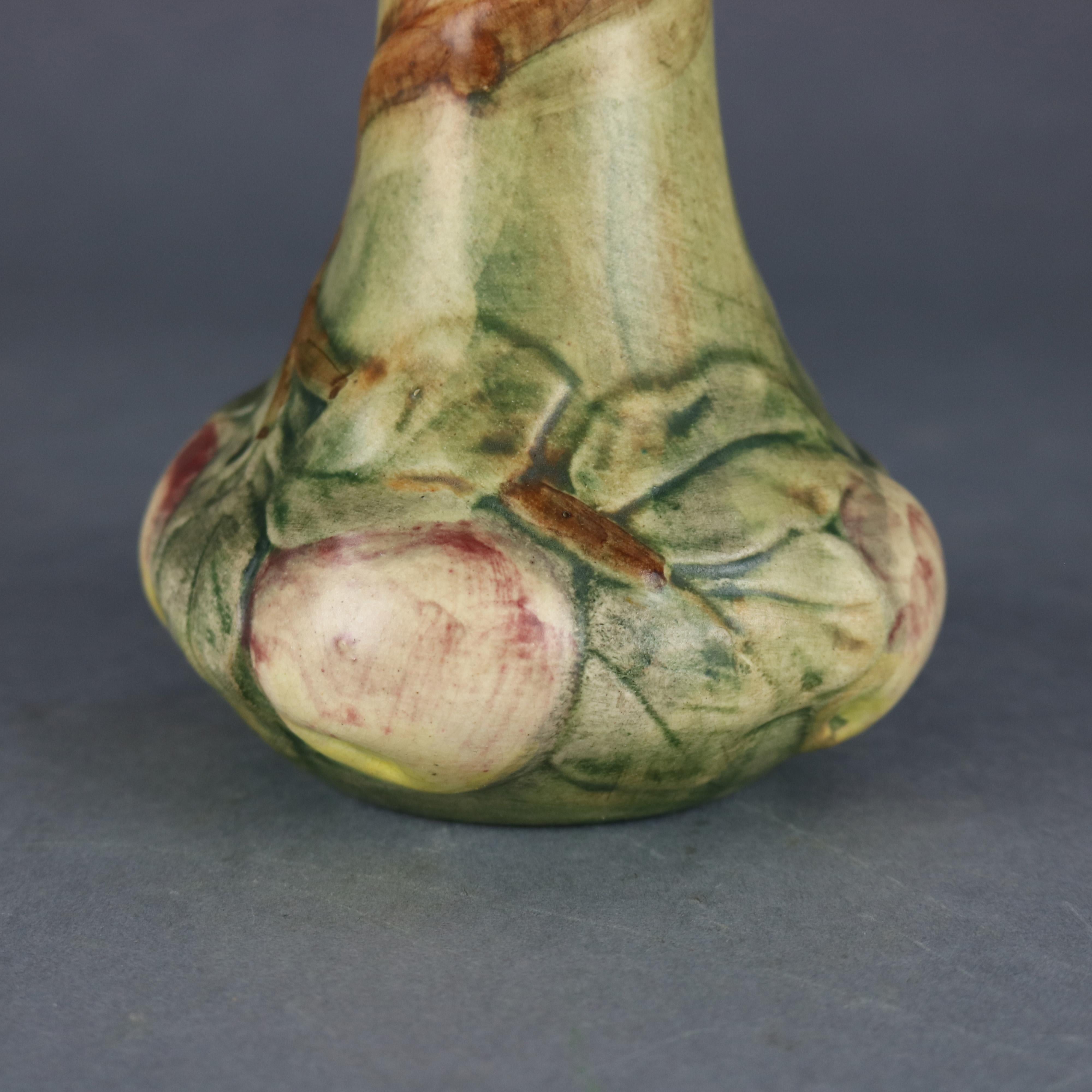 An antique Weller art pottery Woodcraft Baldin Apple Vase offers apple tree with branches, leaves and apples at base, marked on base as photographed, circa 1930

Measures: 8.5