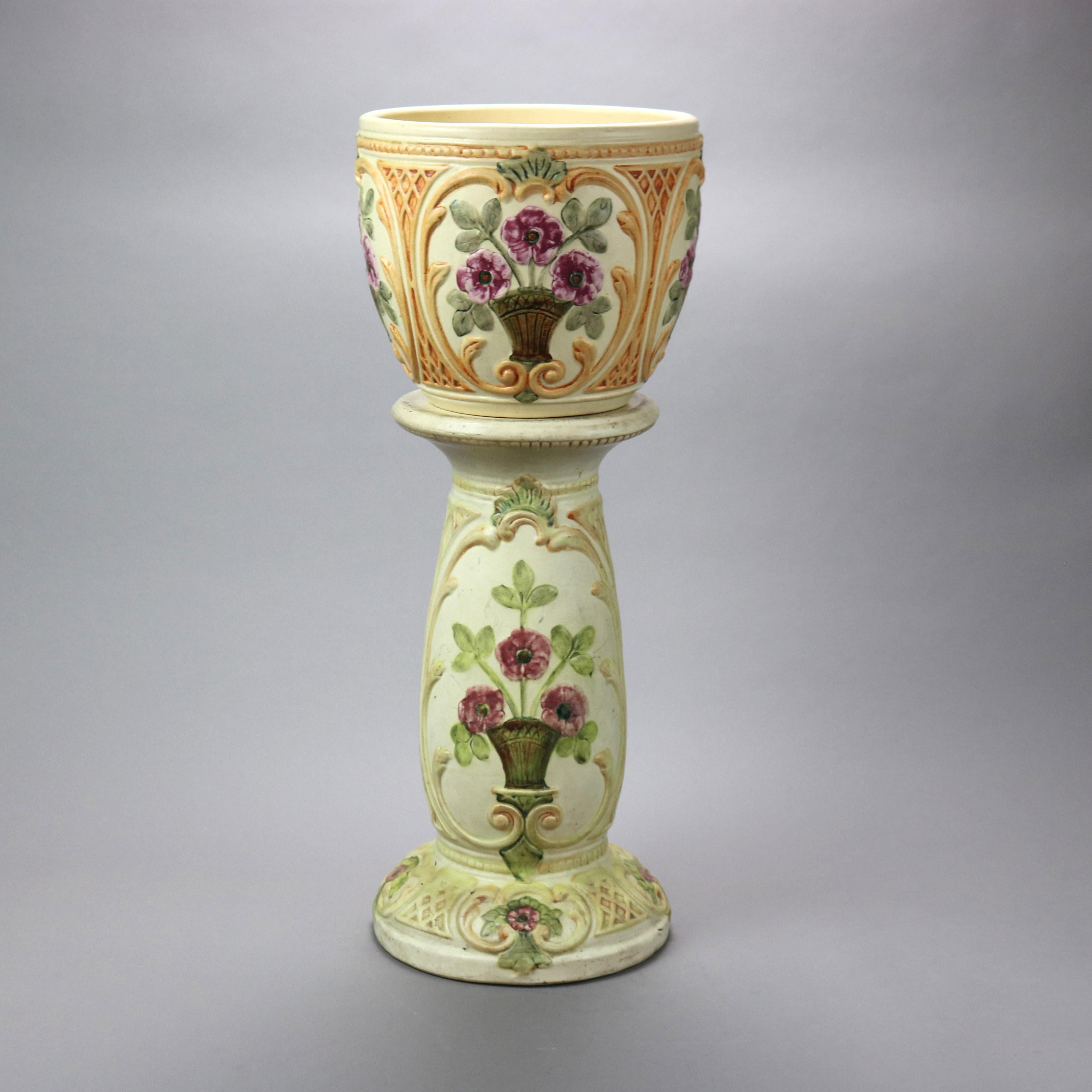 An antique jardiniere and pedestal sert by Weller offers art pottery consstruction with scroll, foliate and lattice decoration having reserves of potted flowers, signed on base as photographed, c1930

Measures - Overall 27.75'' H x 11.25'' W x