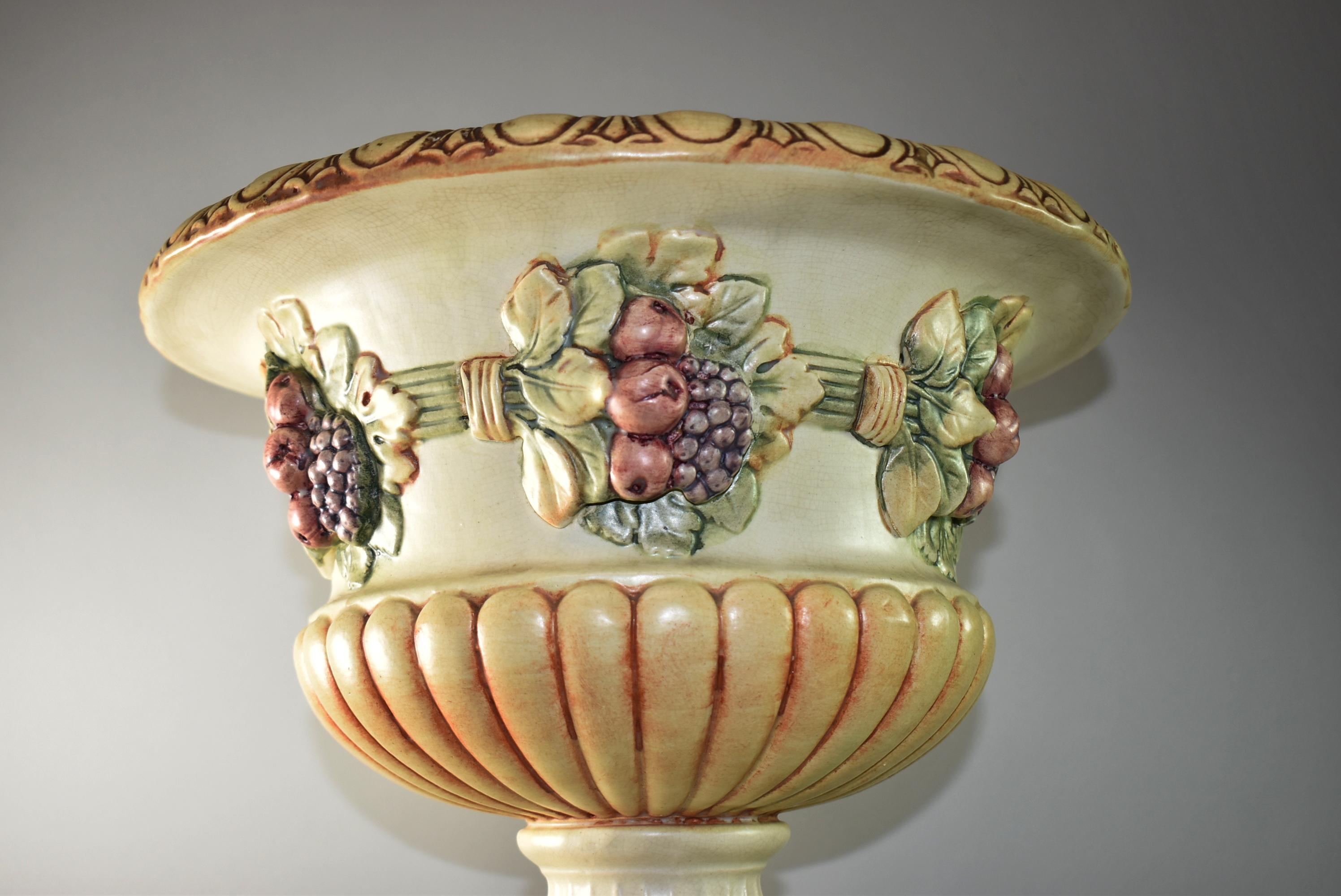 Antique Weller jardinière and pedestal pottery, three pieces, Roma style fruit and leaf border, marked Weller, circa 1910s, light overall crazing, very good condition. Overall dimensions: 28.5