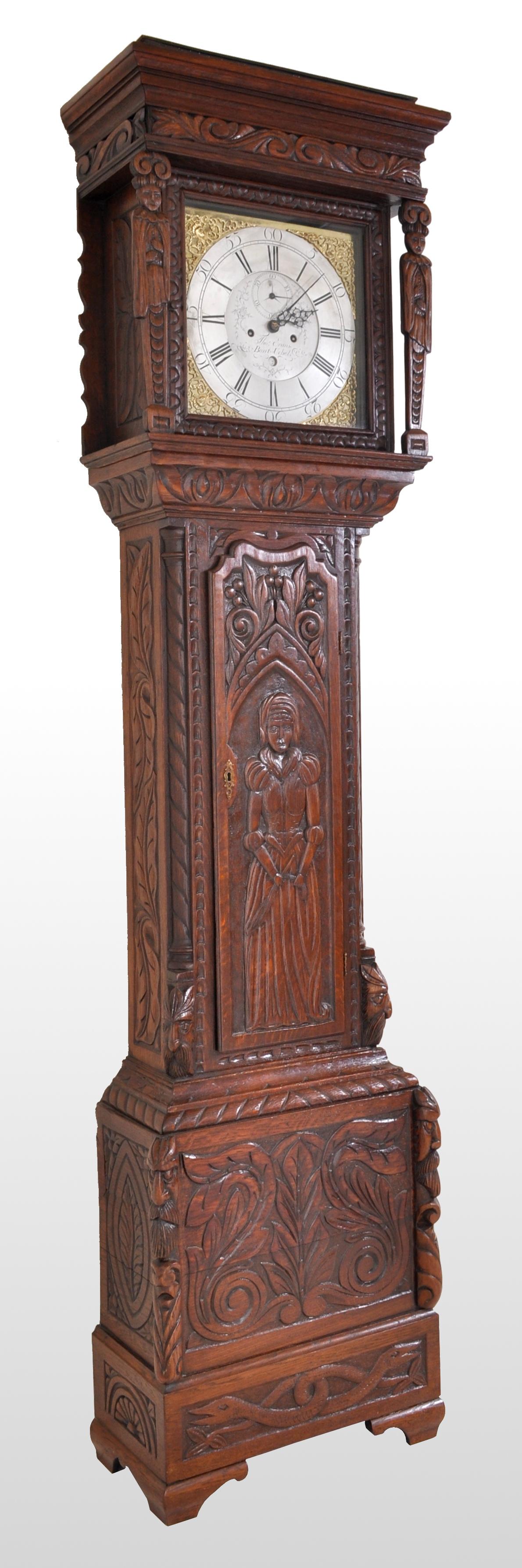 Antique carved welsh oak 8-Day Longcase/Grandfather Clock by Thomas Evans, circa 1770, Wales. The clock housed in a finely and deeply carved stained oak case, the hood having a carved cornice and a pair of figural carved columns. The silvered dial