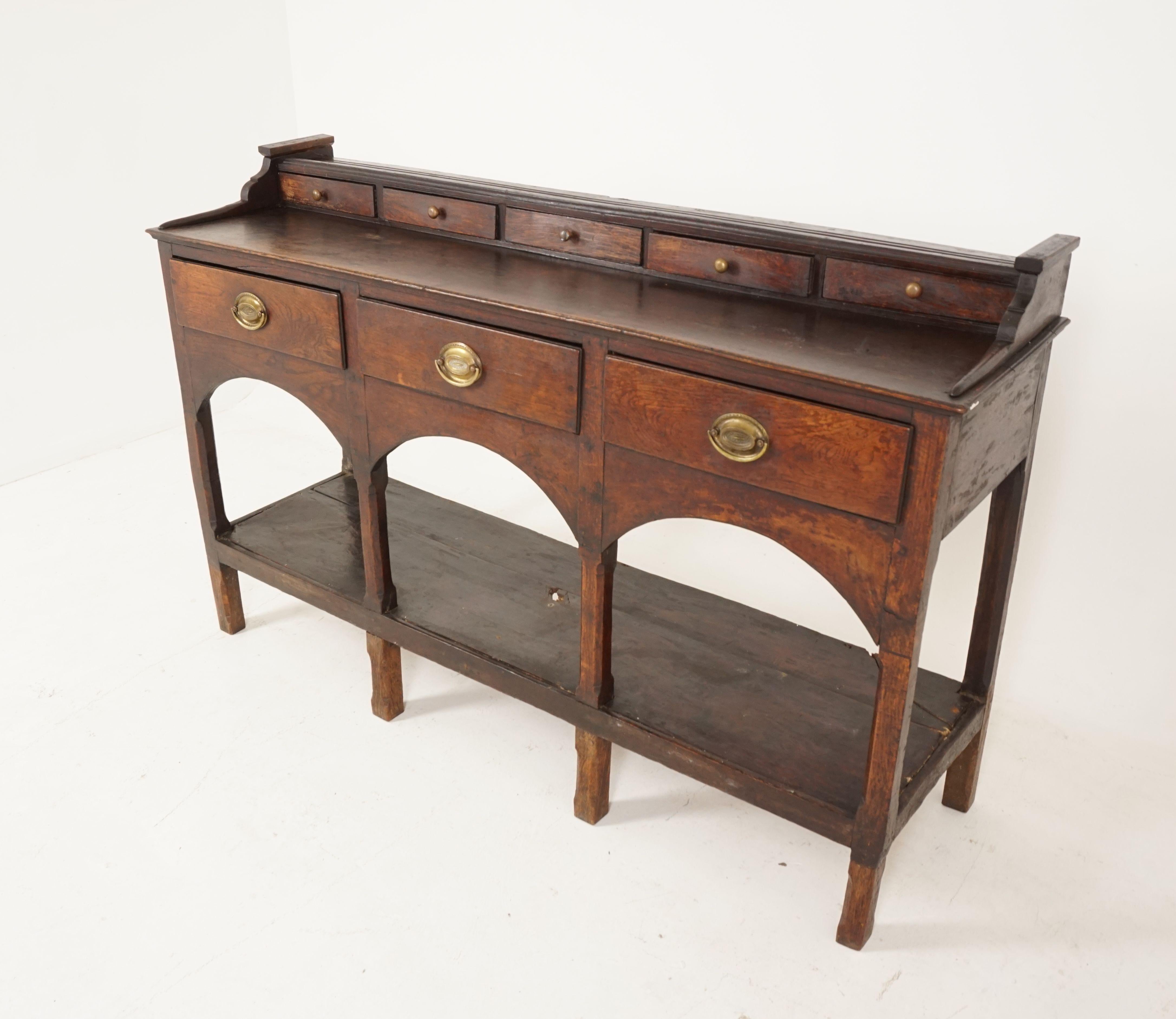Antique welsh oak pot board dresser base, sideboard, wales 1760, B2060

Wales 1760
Original finish
Single plank top
Applied bead plate stand
Five spice drawers below
With replacement hardware over three dovetailed drawers
With replacement