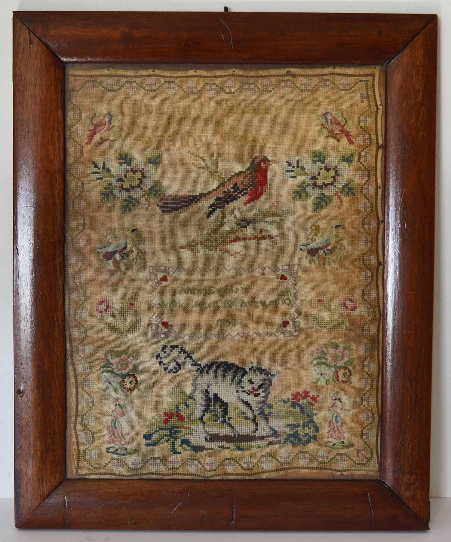 Lovely Welsh sampler with a cat and bird.

Pleasant text of Honour Thy Father and Thy Mother

By Anne Evans, 1853

Most unusual with having the wool work cat as a subject.

Original rosewood frame

The measurement given below is the frame