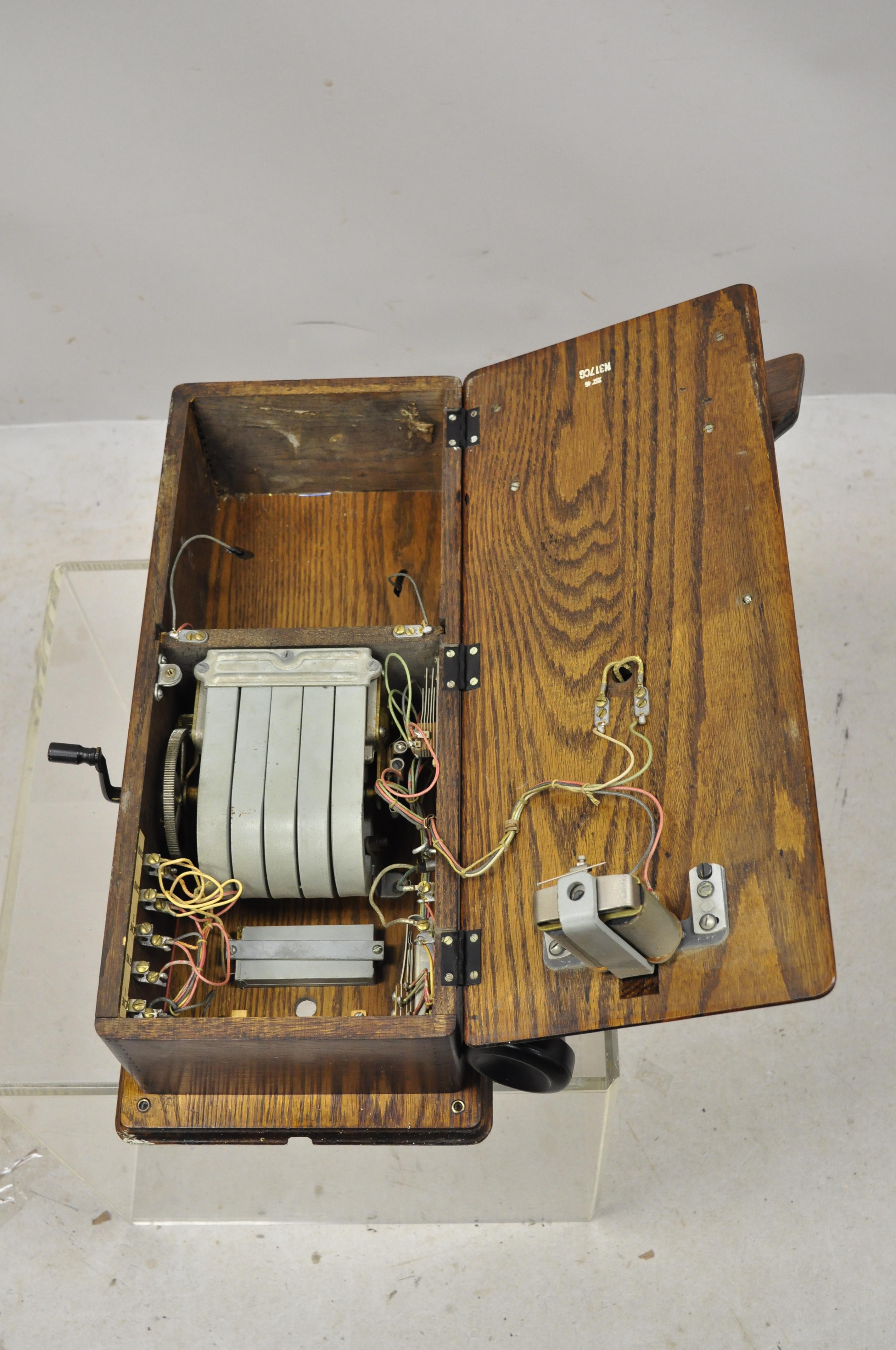 North American Antique Western Electric N317CG Hand Crank Oak Case Wall Clock Bell Rings