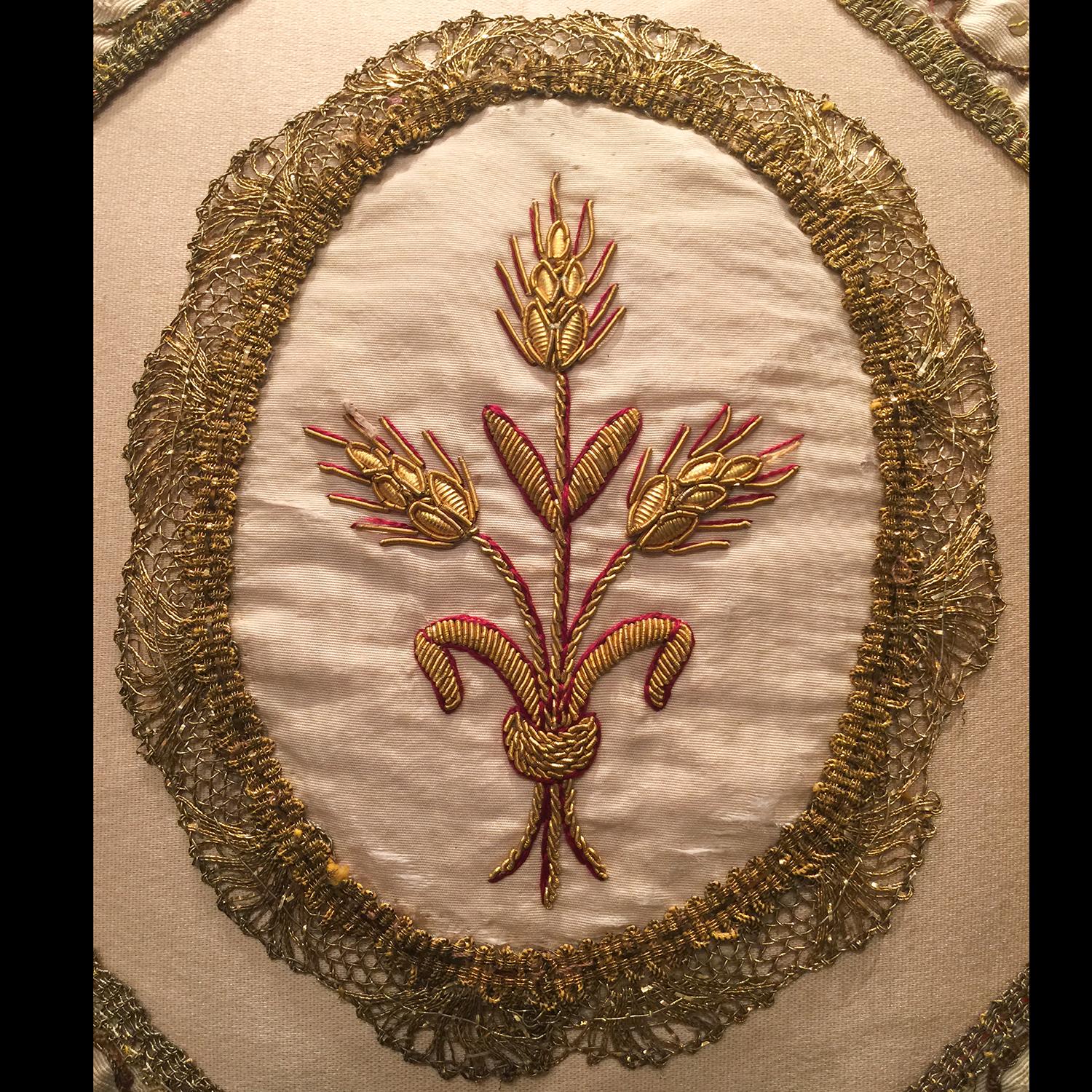 Central medallion of 19th century Italian wheat embroidery is bordered by 18th century Italian shell shaped handmade trim woven throughout with real gold thread. The four triangular shaped 18th century Italian corner fragments are connected by four