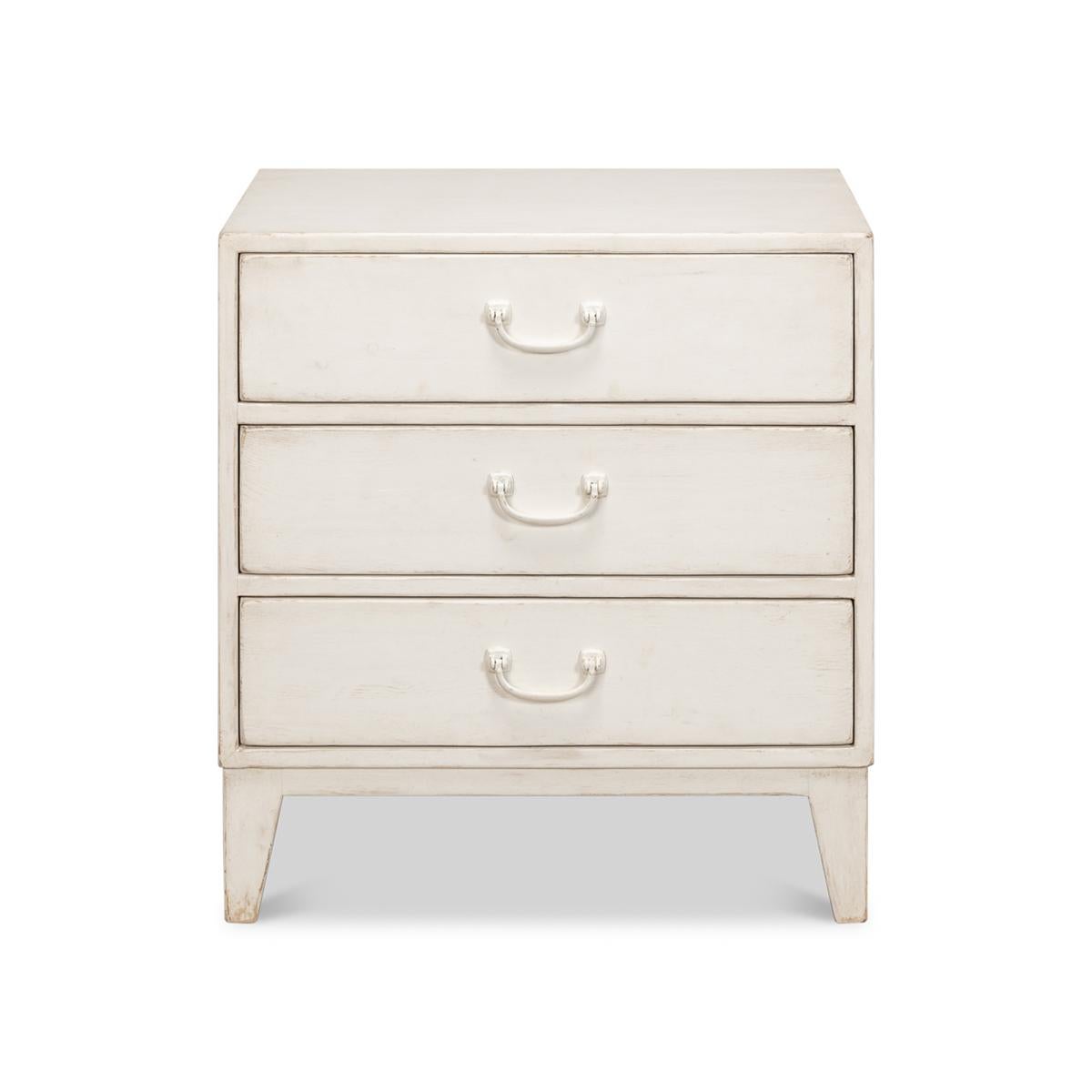 With its creamy antique white finish and shapely, traditional silhouette, it brings a timeless charm to your decor. The three drawers are adorned with classic bail handles, offering both functionality and a quaint aesthetic. Its compact size makes