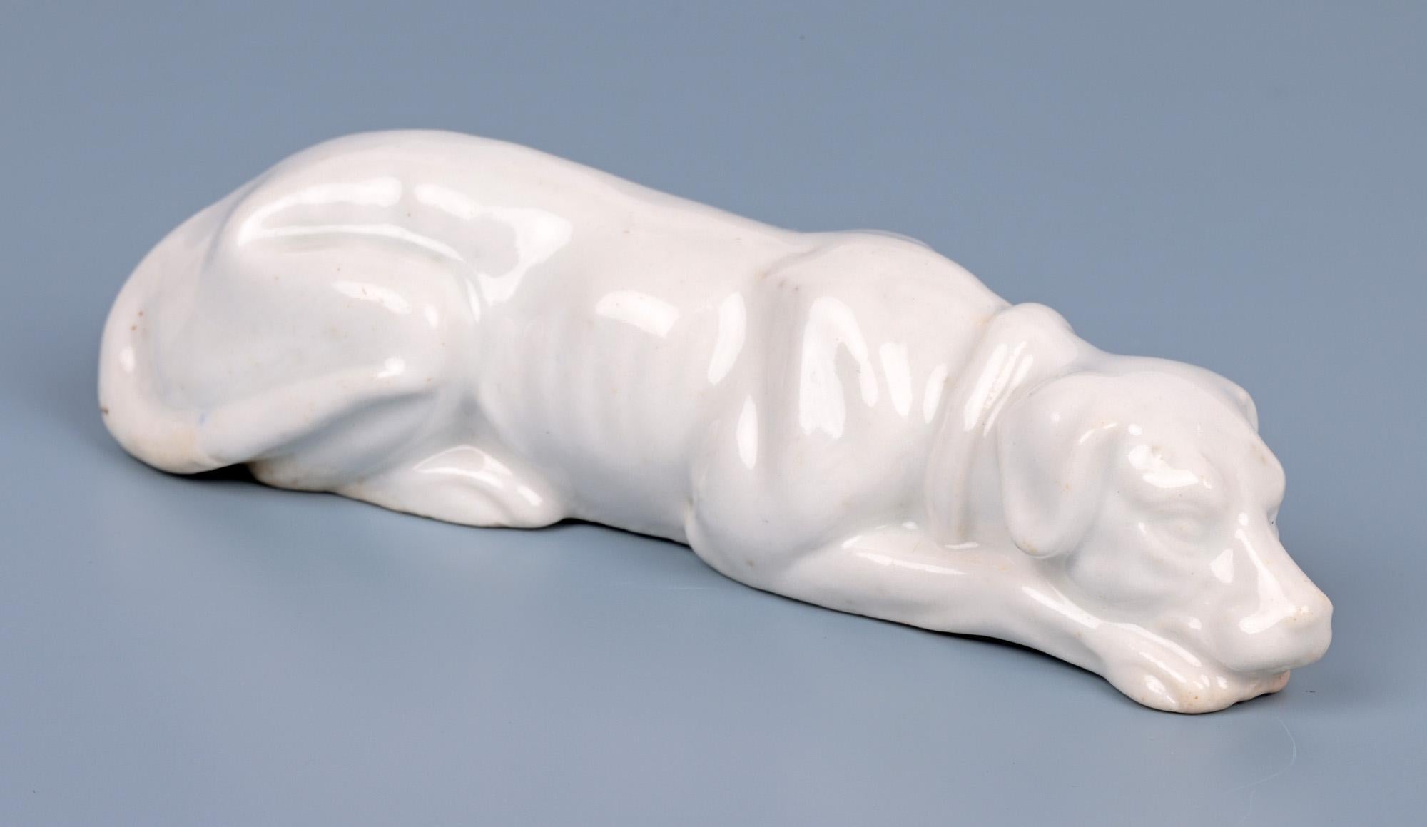 English Antique White Glazed Porcelain Recumbent Hound Figure For Sale