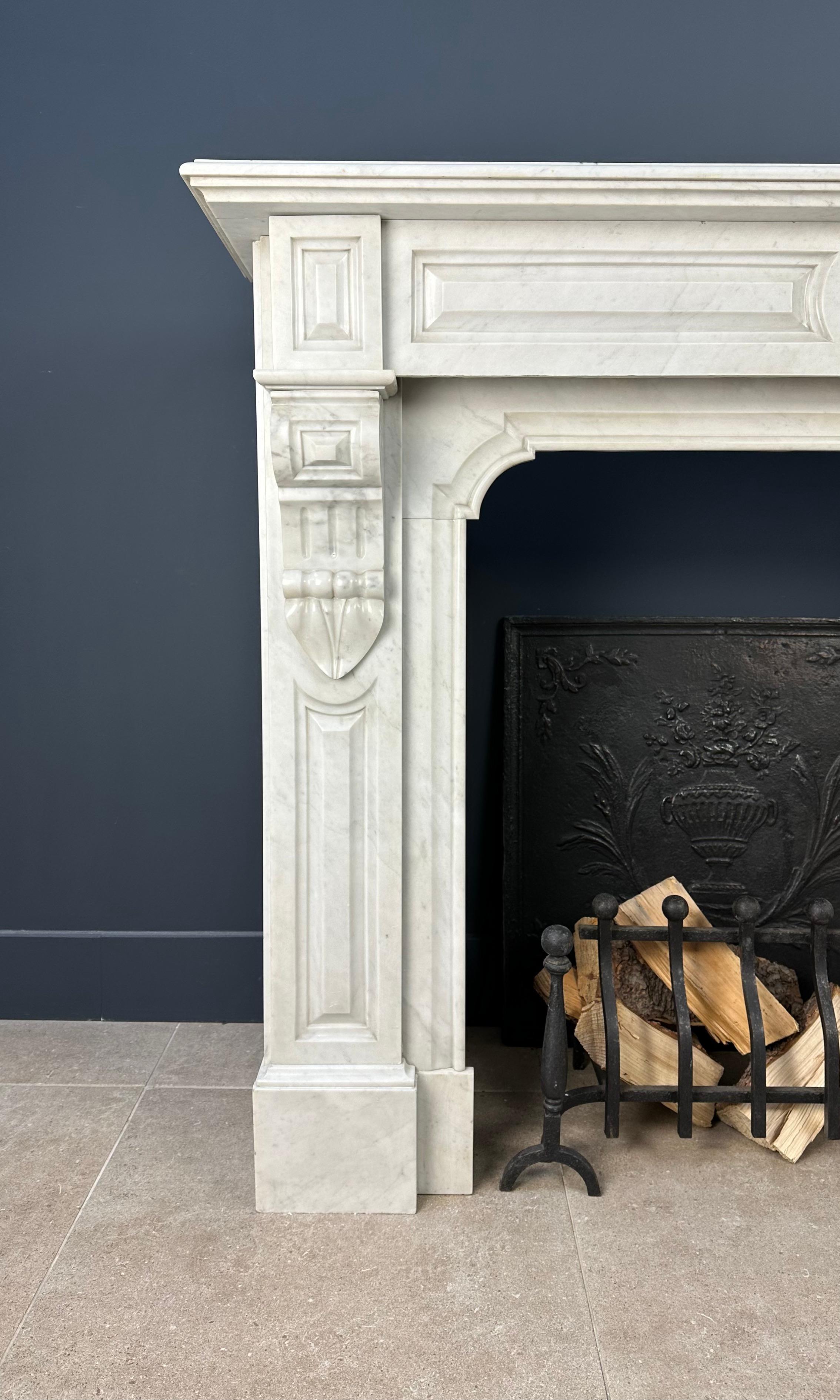 A beautiful antique white marble circulating fireplace made of Carrara marble. This fireplace is richly detailed. The front and the frame pieces are profiled, as is the top. This is a circular fireplace that is supplied with return pieces so that