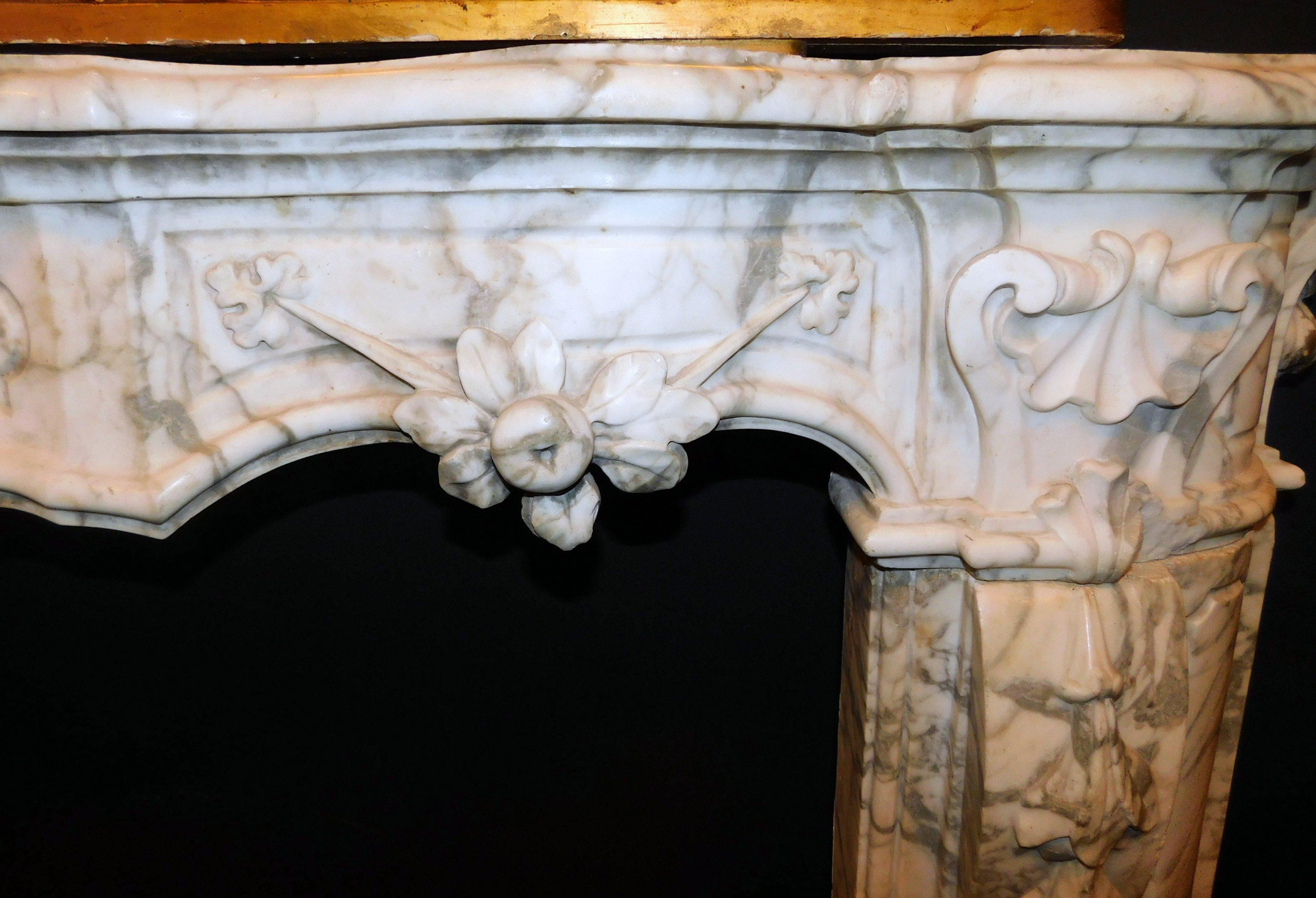 Carrara Marble Antique White Marble Fireplace with Mask and Friezes, 18th Century, Italy For Sale